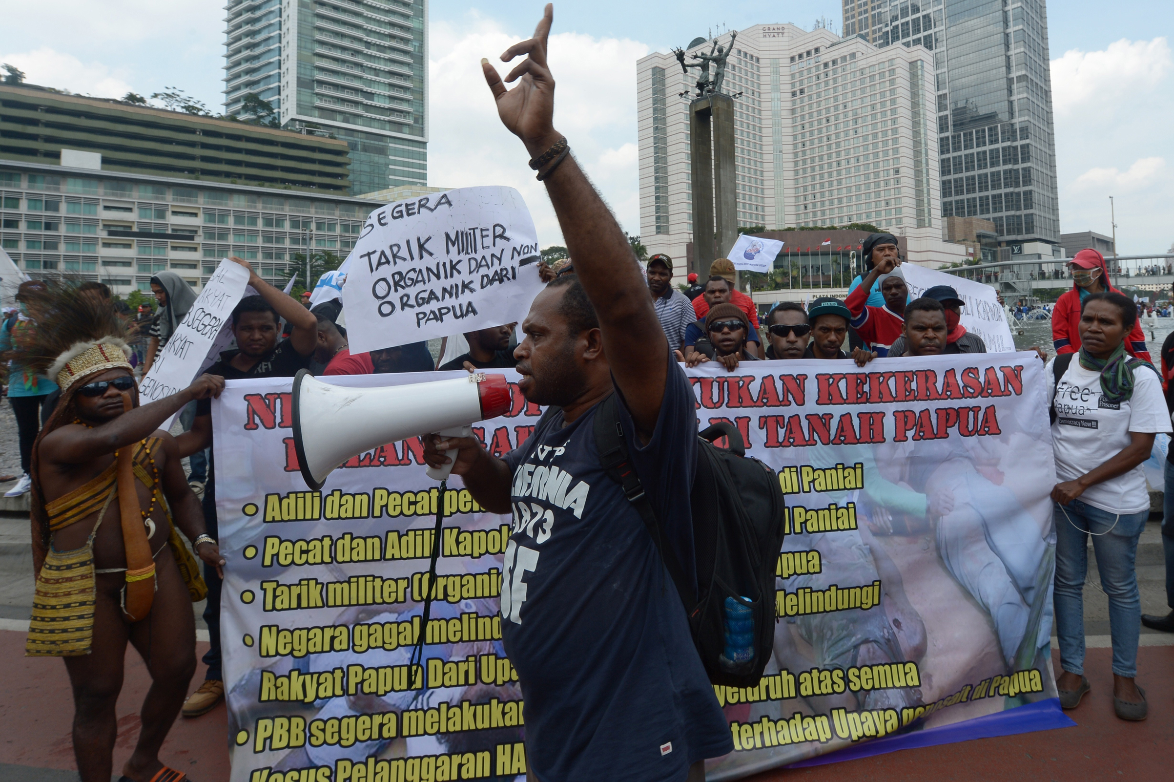 A Papuanese activist delivers speech during a protest against the fatal shooting of teenagers during clashes with security forces in Enarotali, at the Hotel Indonesia roundabout in Jakarta on Dec. 10, 2014. (Adek Berry—AFP/Getty Images)