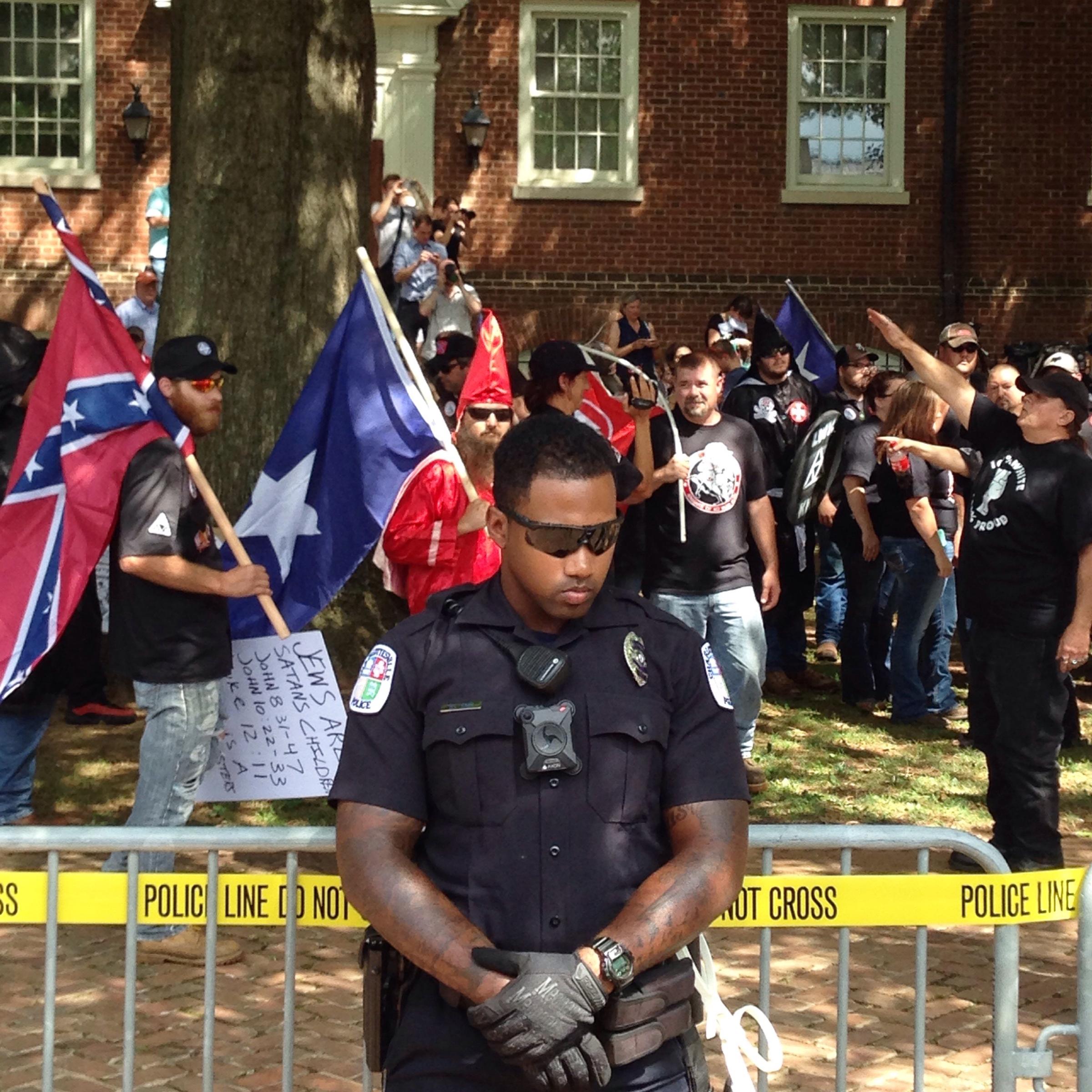 An officer patrols in front of a recent KKK rally in Charlottesville, Va.