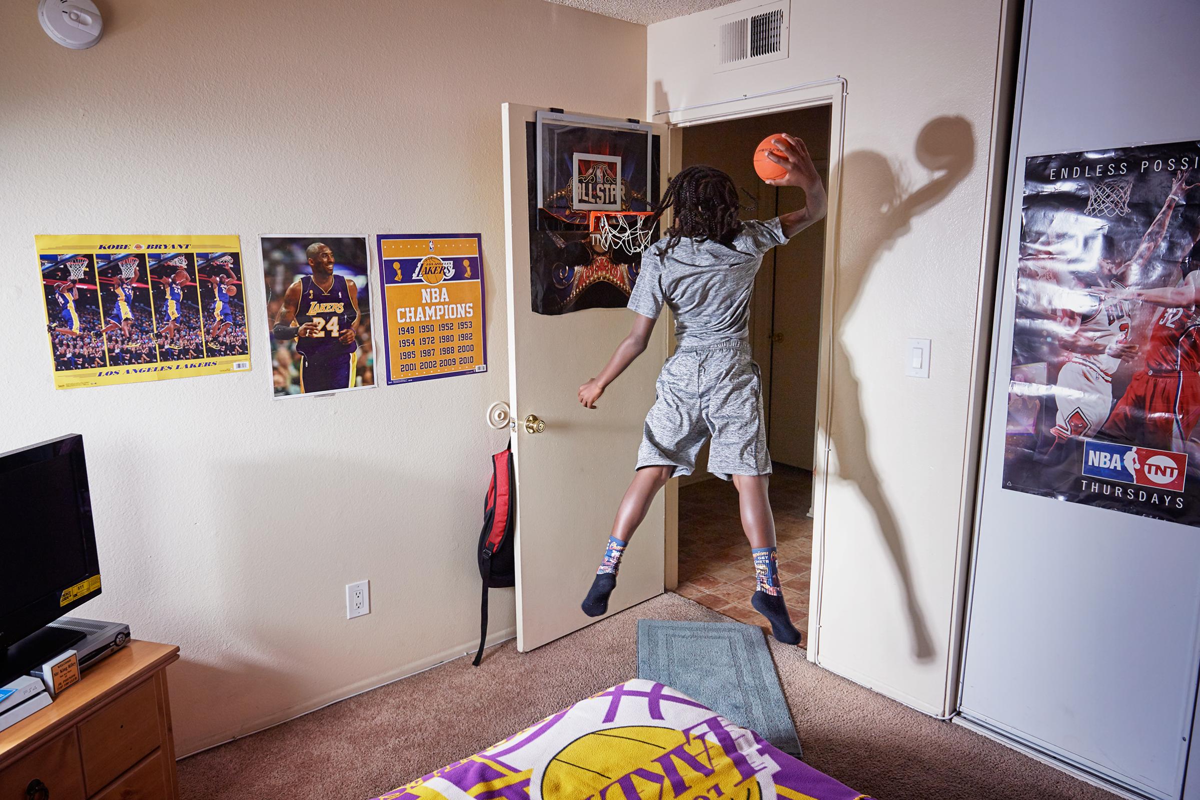 King-Riley Owens, 9, who is ranked as a five-star prospect by the National Youth Basketball Report, lives in L.A. but has already played in tournaments in Utah, Texas and Nevada. His parents have used GoFundMe to help pay for the travel. If the NBA doesn’t work out, King-Riley wants to be a veterinarian. Here King-Rily is photographed at home on Aug. 2, 2017