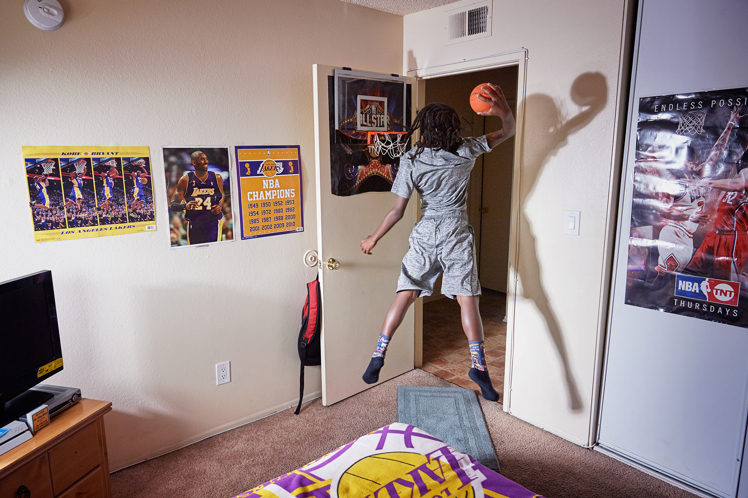 King-Riley Owens, 9, who is ranked as a five-star prospect by the National Youth Basketball Report, lives in L.A. but has already played in tournaments in Utah, Texas and Nevada. His parents have used GoFundMe to help pay for the travel. If the NBA doesn’t work out, King-Riley wants to be a veterinarian. Here King-Rily is photographed at home on Aug. 2, 2017. (Finlay MacKay for TIME)