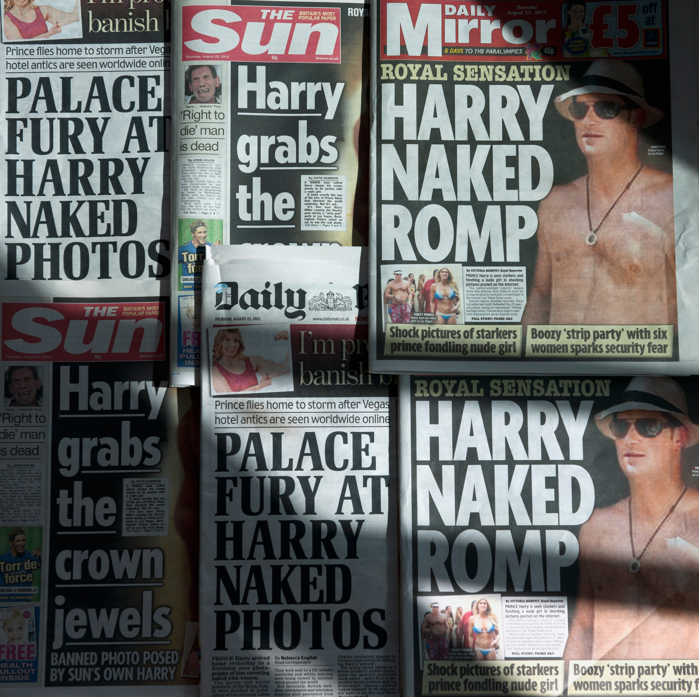 An arrangment of British daily newspapers photographed in London on August 23, 2012 shows the front-page headlines and stories regarding nude pictures of Britain's Prince Harry. Daniel Sorabj—AFP/Getty Images. (Daniel Sorabj—AFP/Getty Images.)