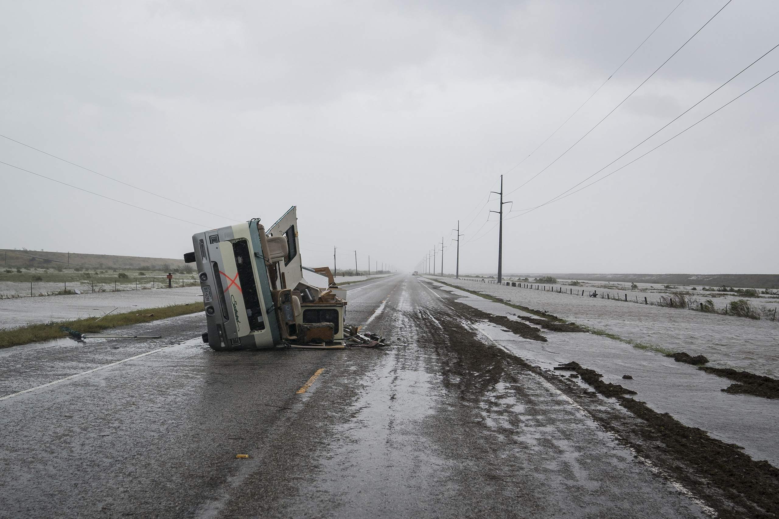 An RV is seen destroyed along the road near City-By-The Sea, TX as Hurricane Harvey hits the Texas coast on Aug 26, 2017. (Jabin Botsford—The Washington Post/Getty Images)