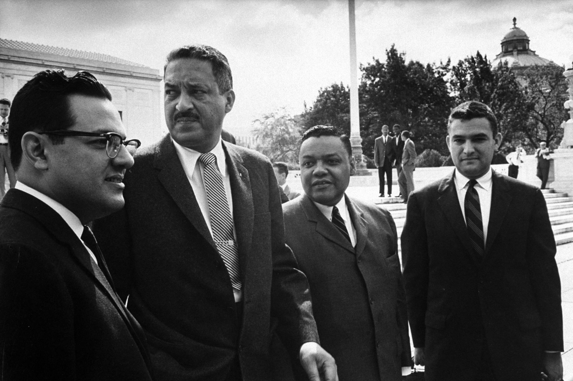 Thurgood Marshall and others leaving the U.S.Supreme Court after hearing on School Intergration, 1958.