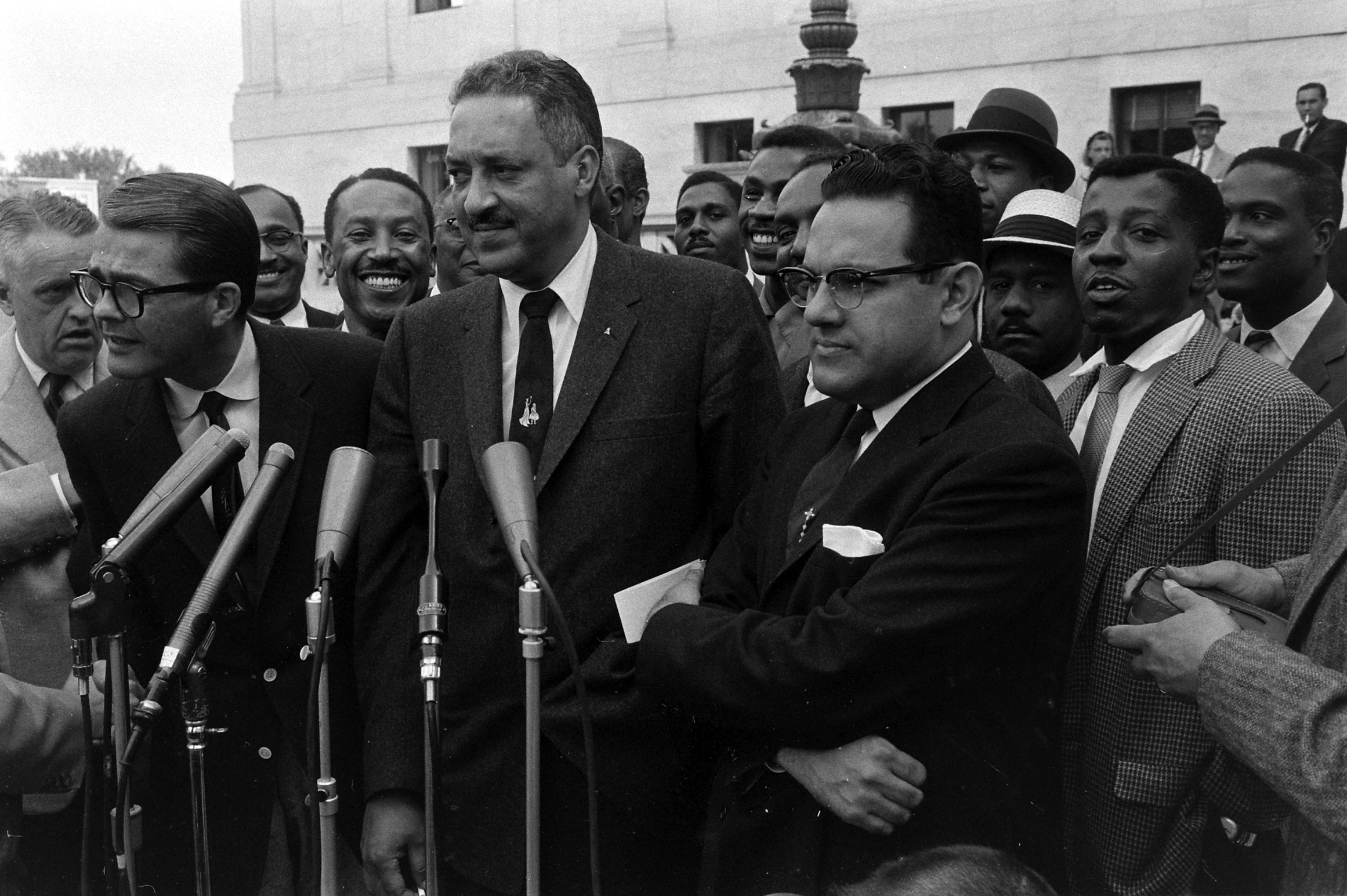 Thurgood Marshall speaking in front of the U.S. Supreme Court after Court's upholding Little Rock desegregation order, 1958.