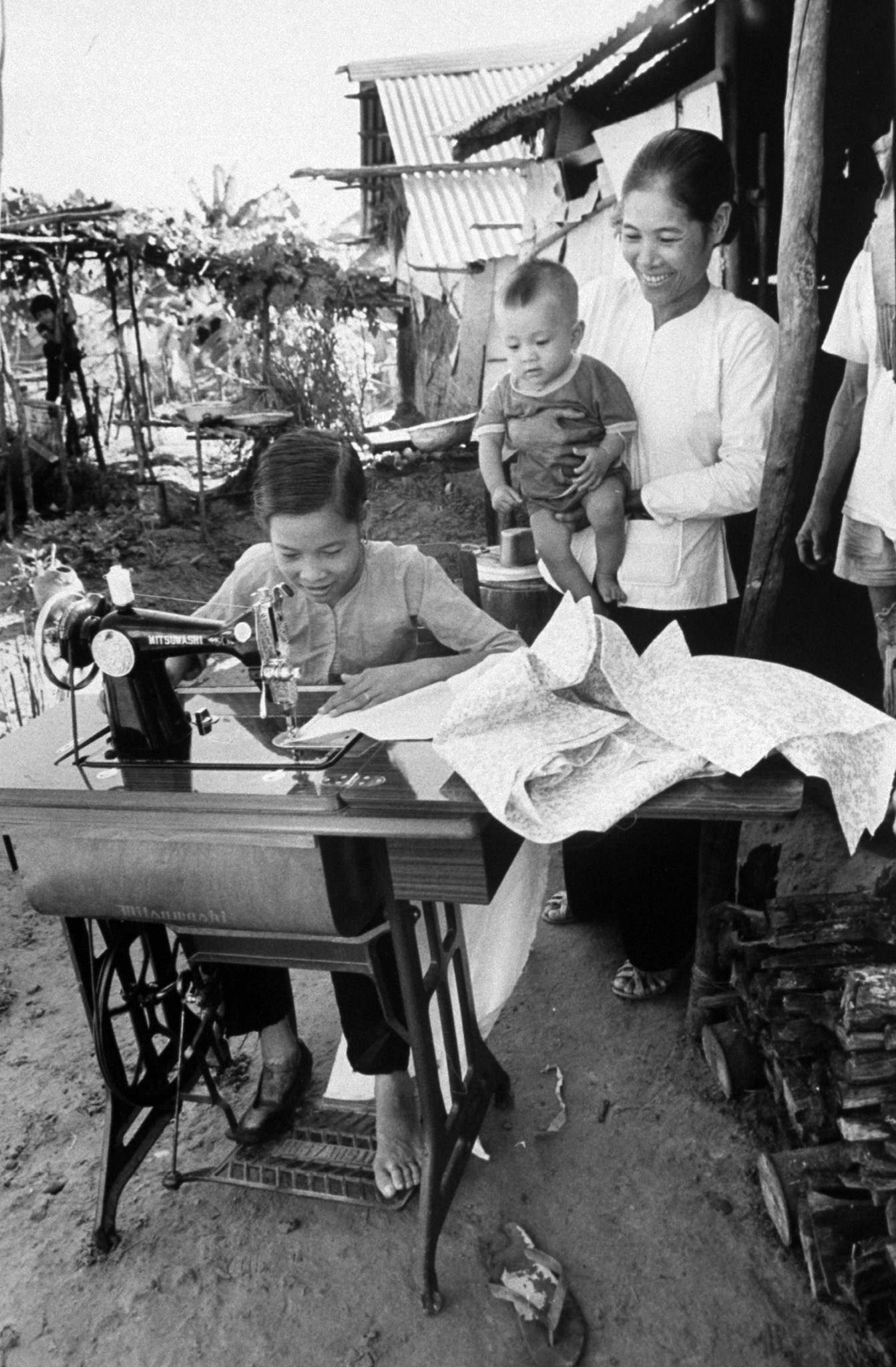 Nguyen Thi Tron at the sewing machine given to her by LIFE photographer Larry Burrows.