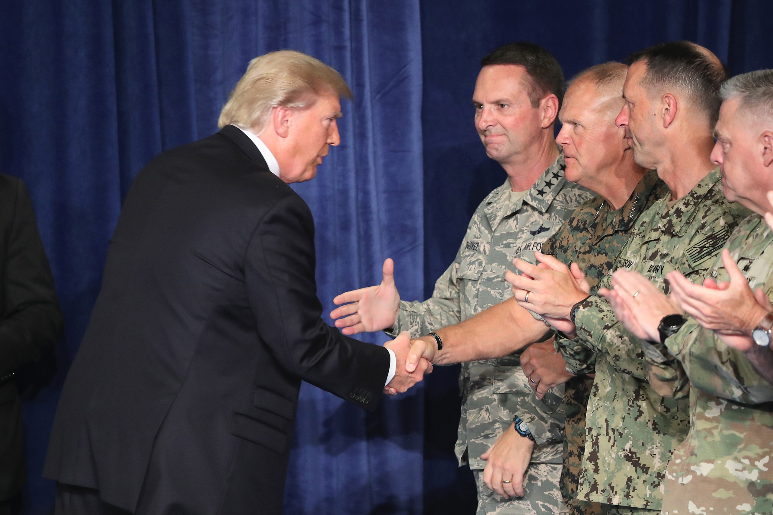 President Donald Trump greets military leaders before his speech on Afghanistan at the Fort Myer military base in Arlington, Virginia, on Aug. 21, 2017. (Mark Wilson—Getty Images)