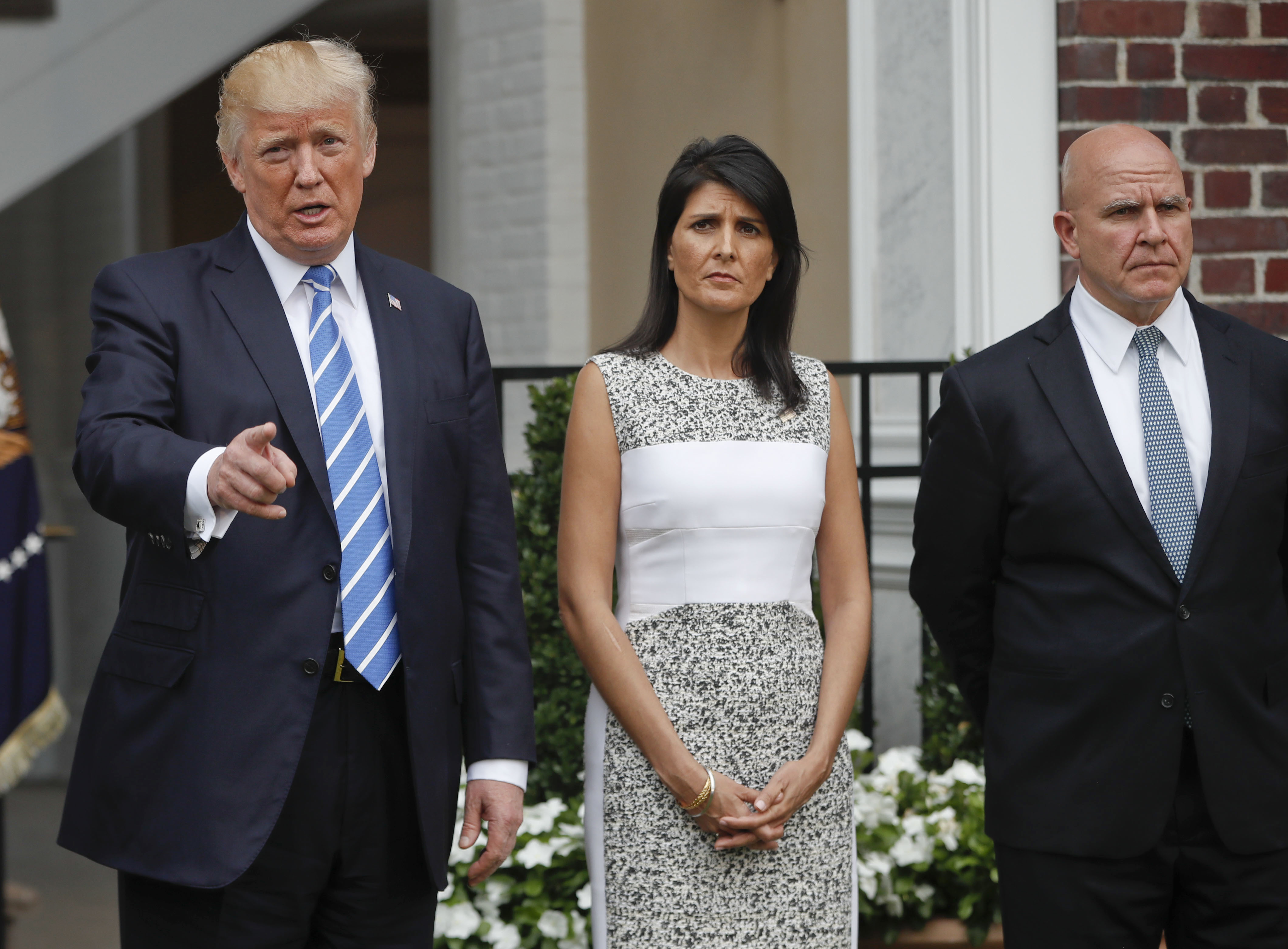 P Trump alongside U.S. Ambassador to the United Nations Nikki Haley and national security adviser H.R. McMaster at Trump National Golf Club in Bedminster, N.J., on Aug. 11, 2017. (Pablo Martinez Monsivai—AP)
