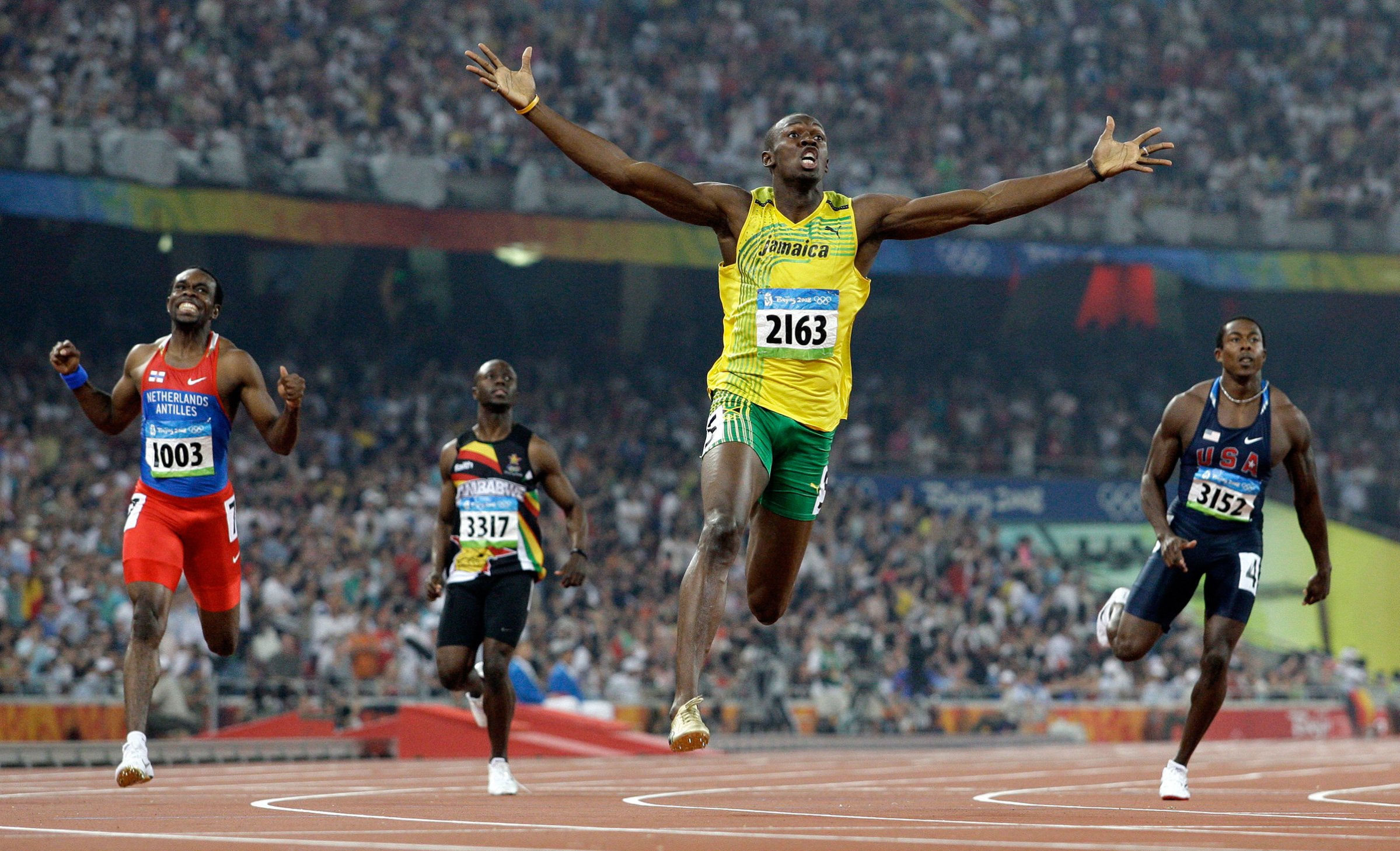 Jamaica's Usain Bolt crosses the finish line to win the gold in the men's 200-meter final during the athletics competitions in the National Stadium at the Beijing 2008 Olympics, Aug. 20, 2008.