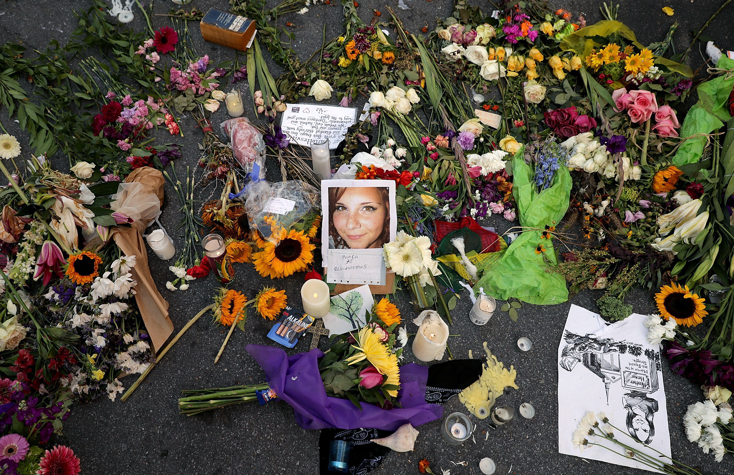 A makeshift memorial at the spot where Heather Heyer died in Charlottesville on Aug. 12 (Chip Somodevilla—Getty Images)