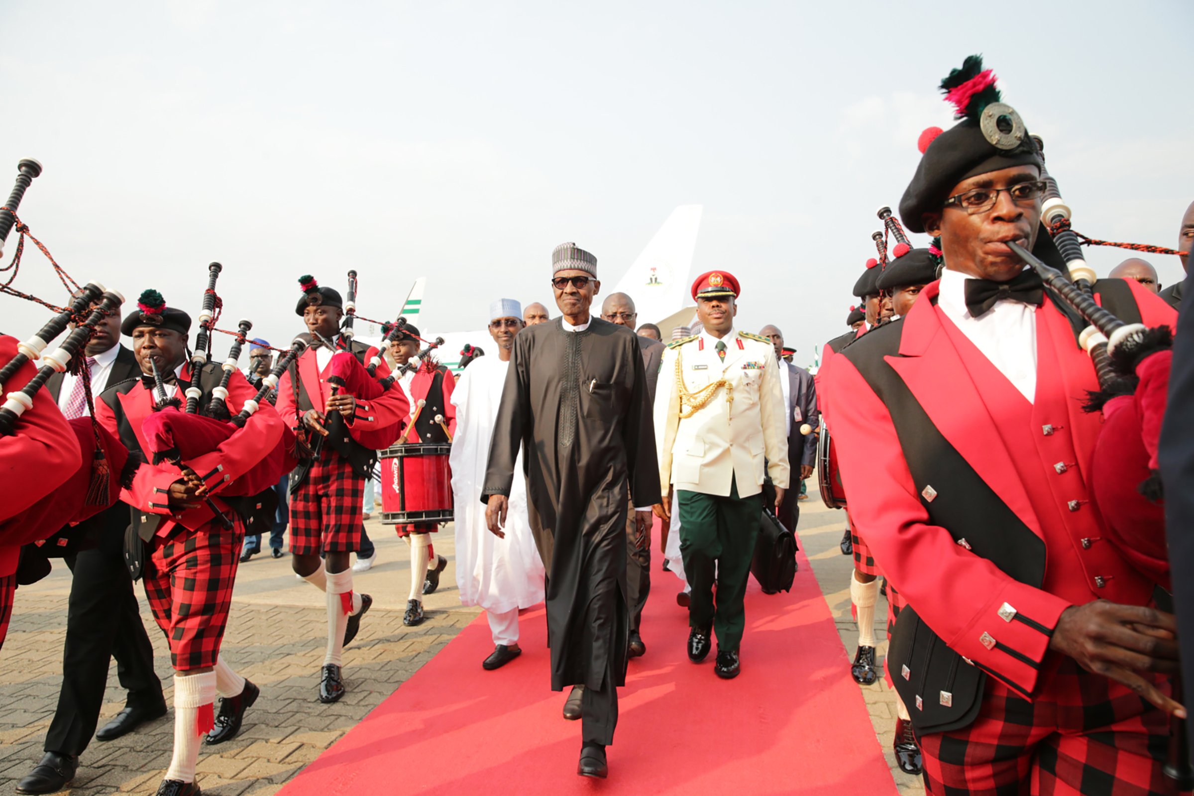 Ailing Nigerian President Mohammadu Buhari walks to the presidential lounge on his return back to the country in Abuja, on Aug. 19, 2017.