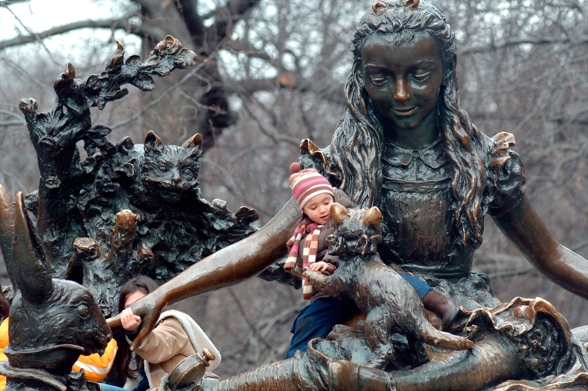 Children play on Central Park’s Alice in Wonderland, one of three monuments to notable women (Linda Rosier—New York Daily News/Getty Images)
