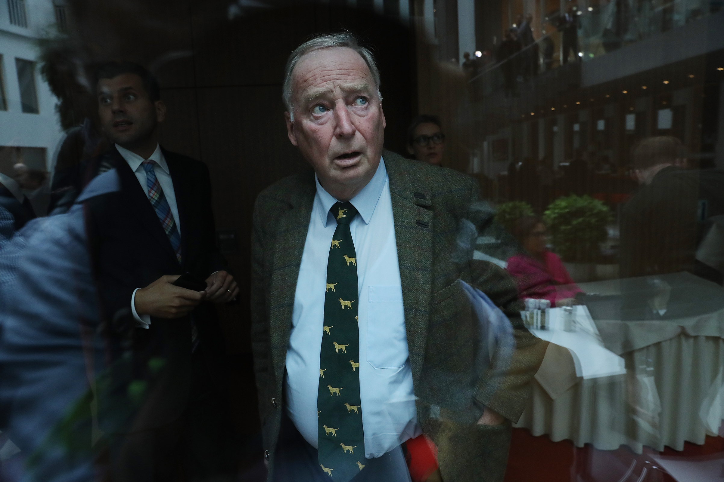 Alexander Gauland, who was a co-lead candidate of the right-wing Alternative for Germany (AfD) party in the German federal elections, is seen through glass following a news conference in Berlin on Sept. 25, 2017. At the conference, AfD member Frauke Petry announced she would quit the party in a surprise move. (Sean Gallup—Getty Images)