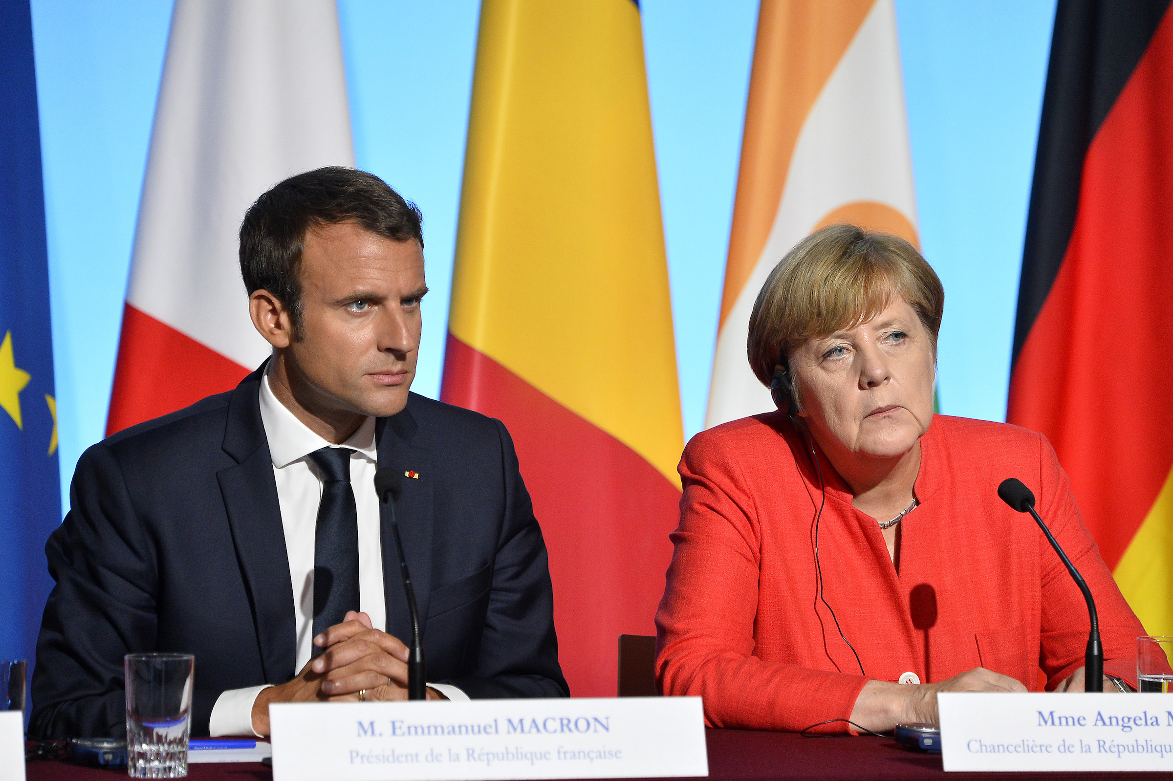 French President Emmanuel Macron and German Chancelor Angela Merkel react during a press conference after the multinational meeting at Elysee Palace on August 28, 2017 in Paris, France. (Aurelien Meunier&mdash;Getty Images)