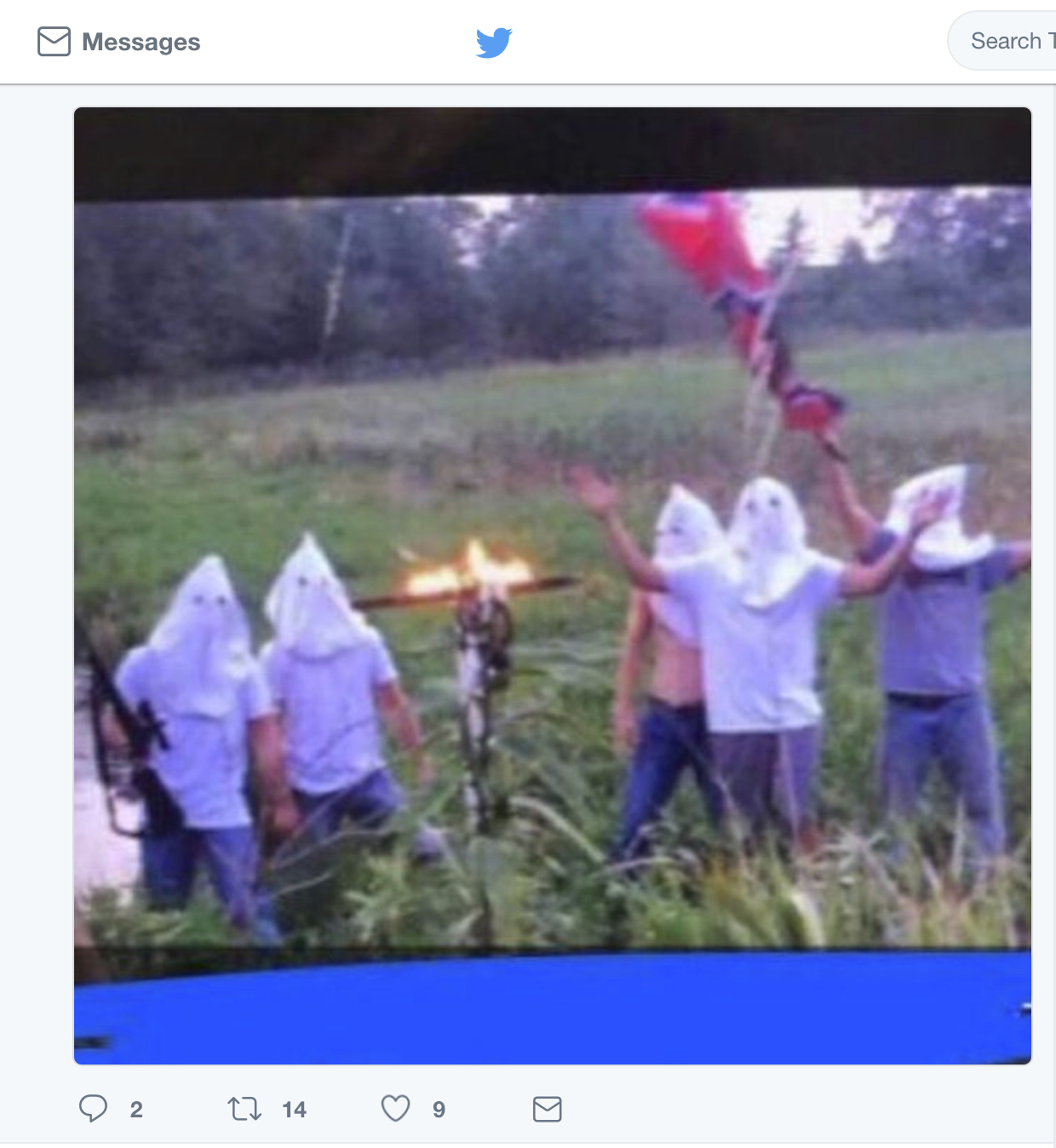 In this screen shot image taken from Twitter, five men wearing white hoods wave a Confederate flag next to a burning cross. The principal of Creston Community High School in southern Iowa says the school has disciplined several students who appeared in the photo, which circulated on social media, after officials became aware of it on Wednesday morning, Sept. 6, 2017. (Twitter via AP—AP)