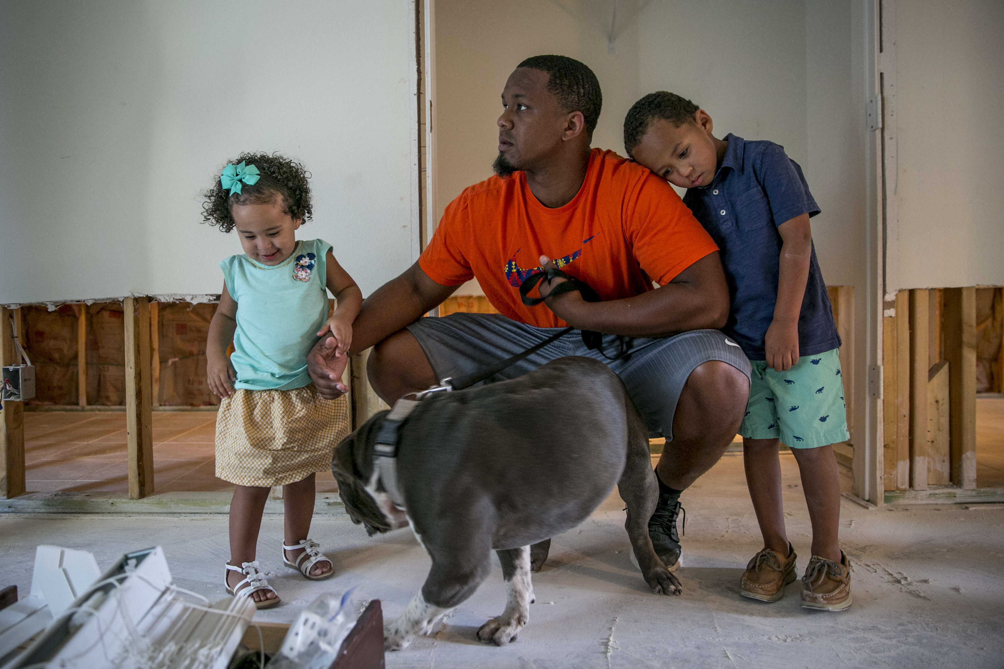 Isiah and his children Bryson and Aubree inside their home. (Ilana Panich-Linsman for TIME)