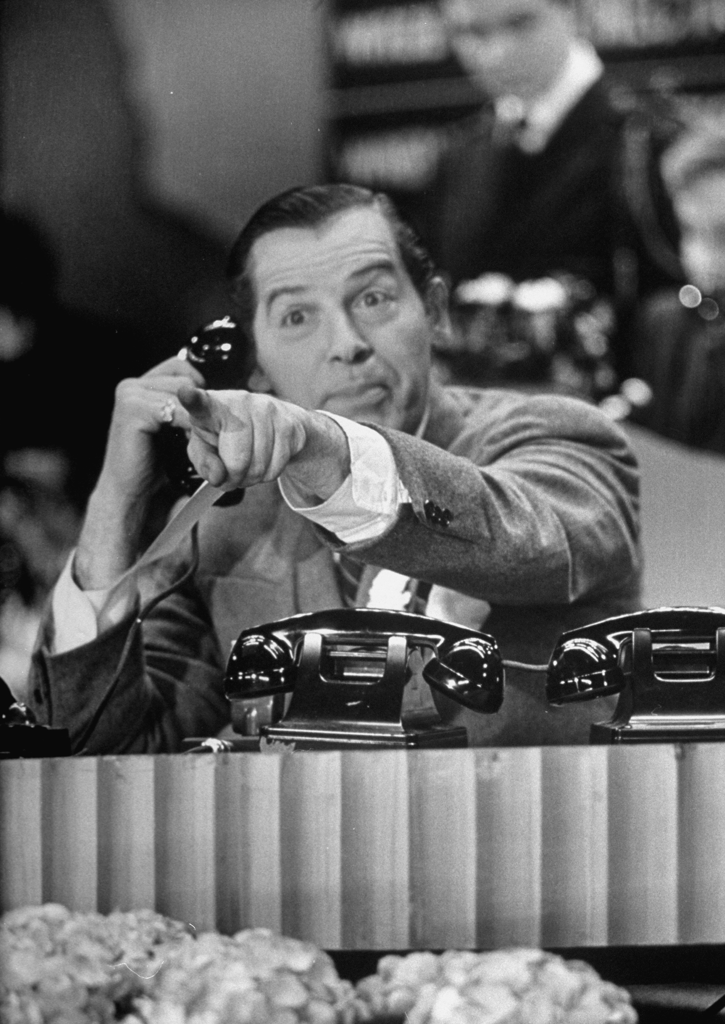 Milton Berle taking a call from a viewer while hosting a fundraiser for the Damon Runyon Memorial Cancer Fund on N.B.C's broadcasting channel. (Martha Holmes/The LIFE Picture Collection—Getty Images)