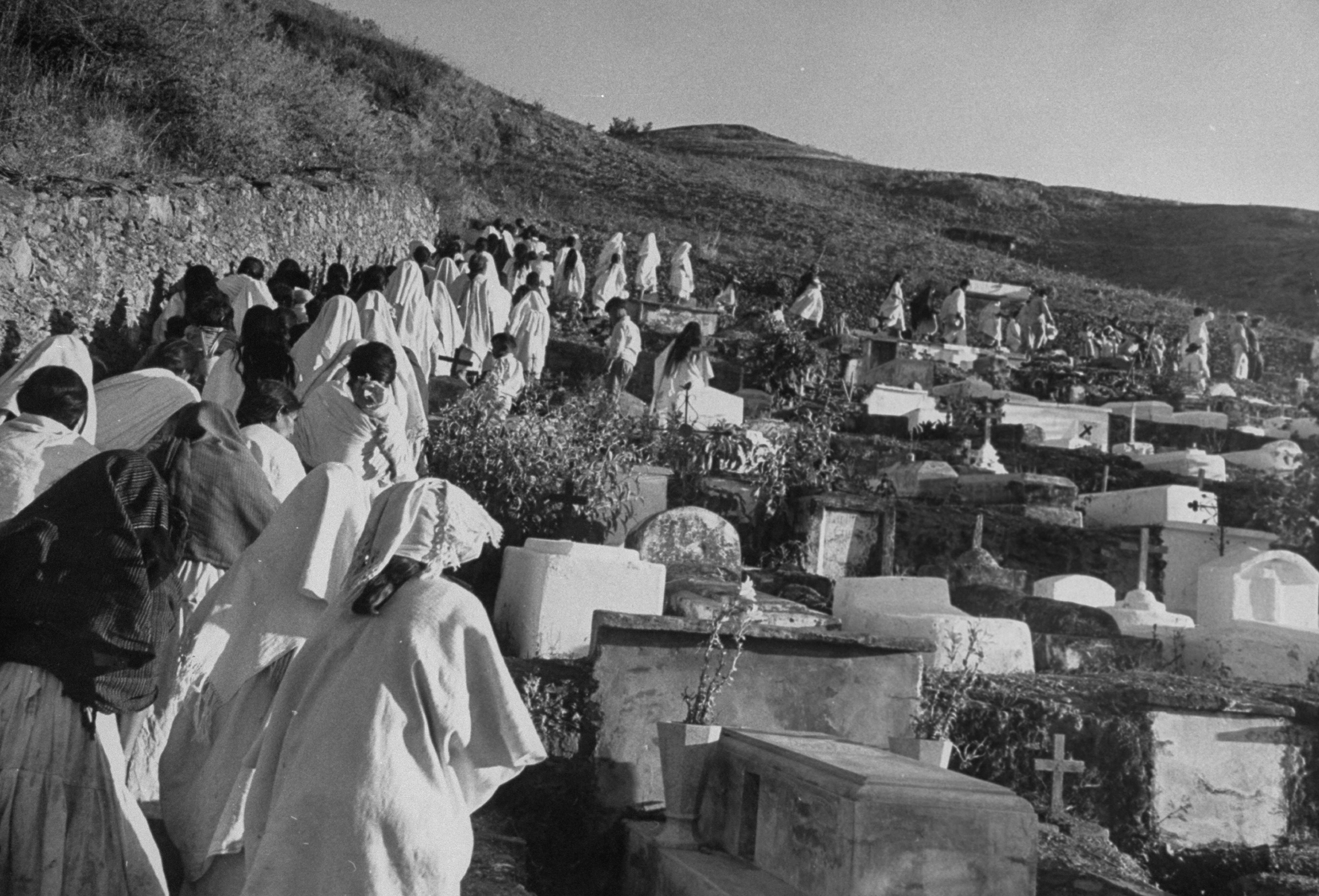 Village procession en route to cemetery, women wearing shawls on heads (Wallace Kirkland&mdash;The LIFE Picture Collection/Getty Images)