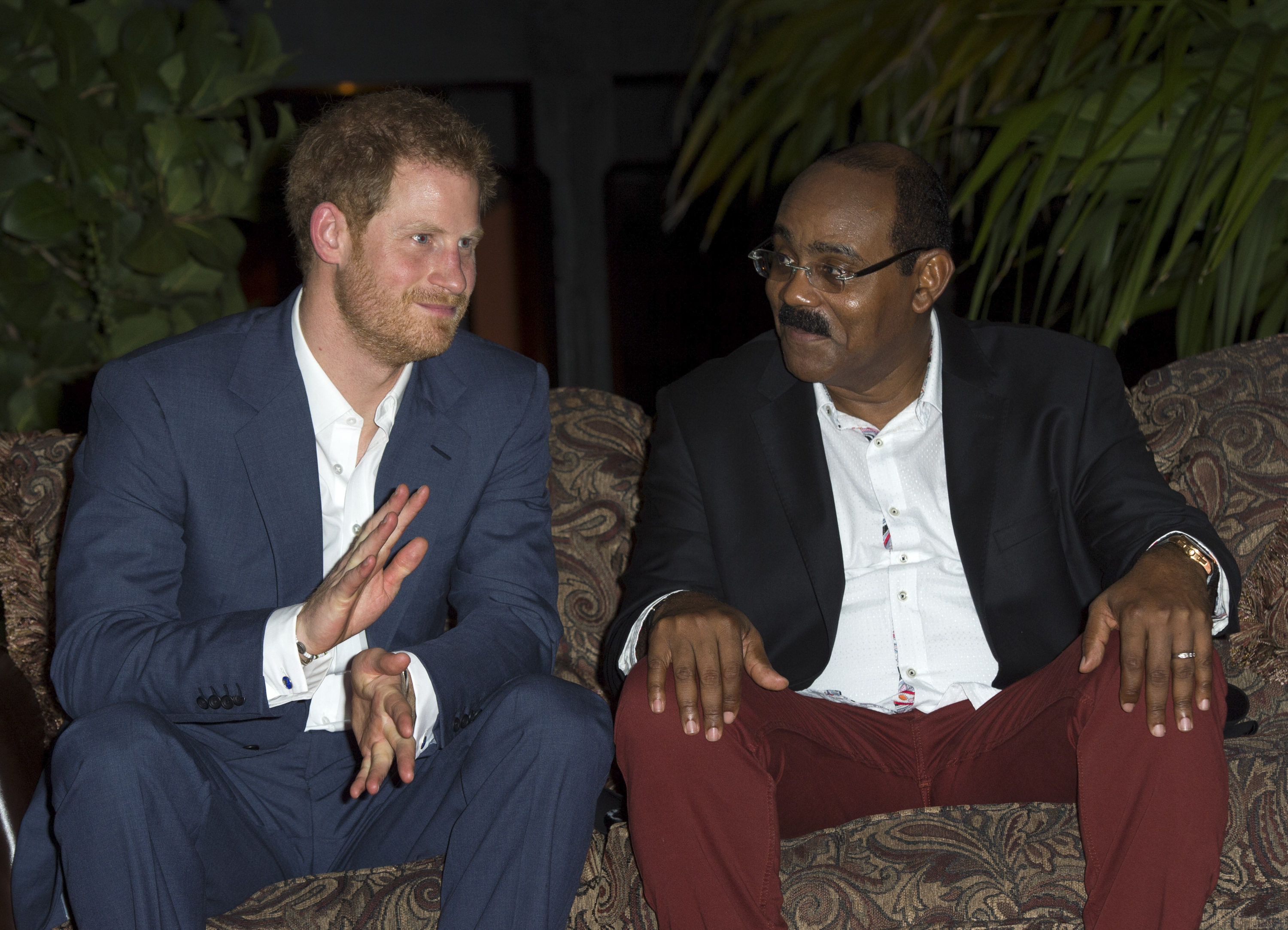 Prime Minister of Antigua and Barbuda Gaston Browne alongside Prince Harry during the British royal's official visit to Antigua on Nov. 21, 2016 (Pool/Samir Hussein—WireImage)