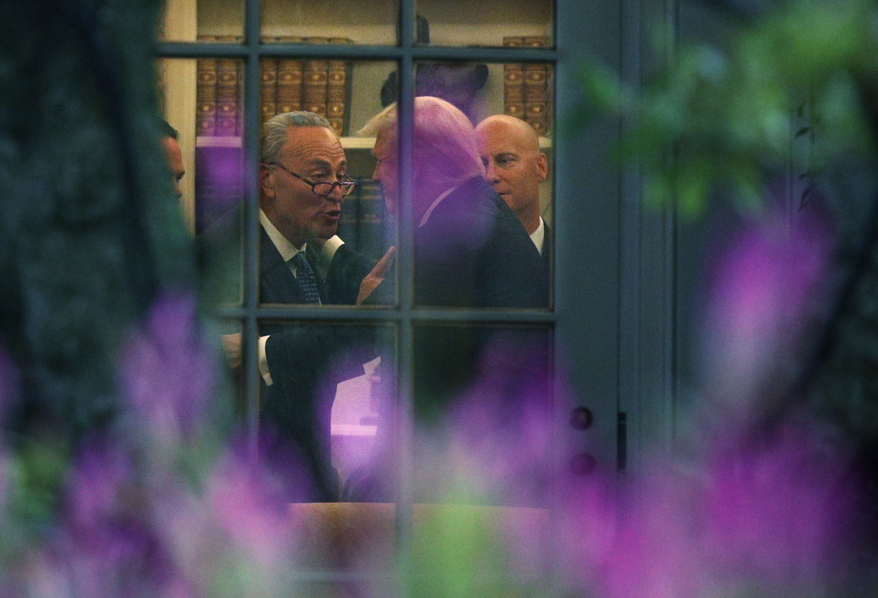 U.S. Senate Minority Leader Chuck Schumer (D-NY) (L) makes a point to President Donald Trump in the Oval Office prior to his departure from the White House September 6, 2017 in Washington, D.C. (Alex Wong&mdash;Getty Images)