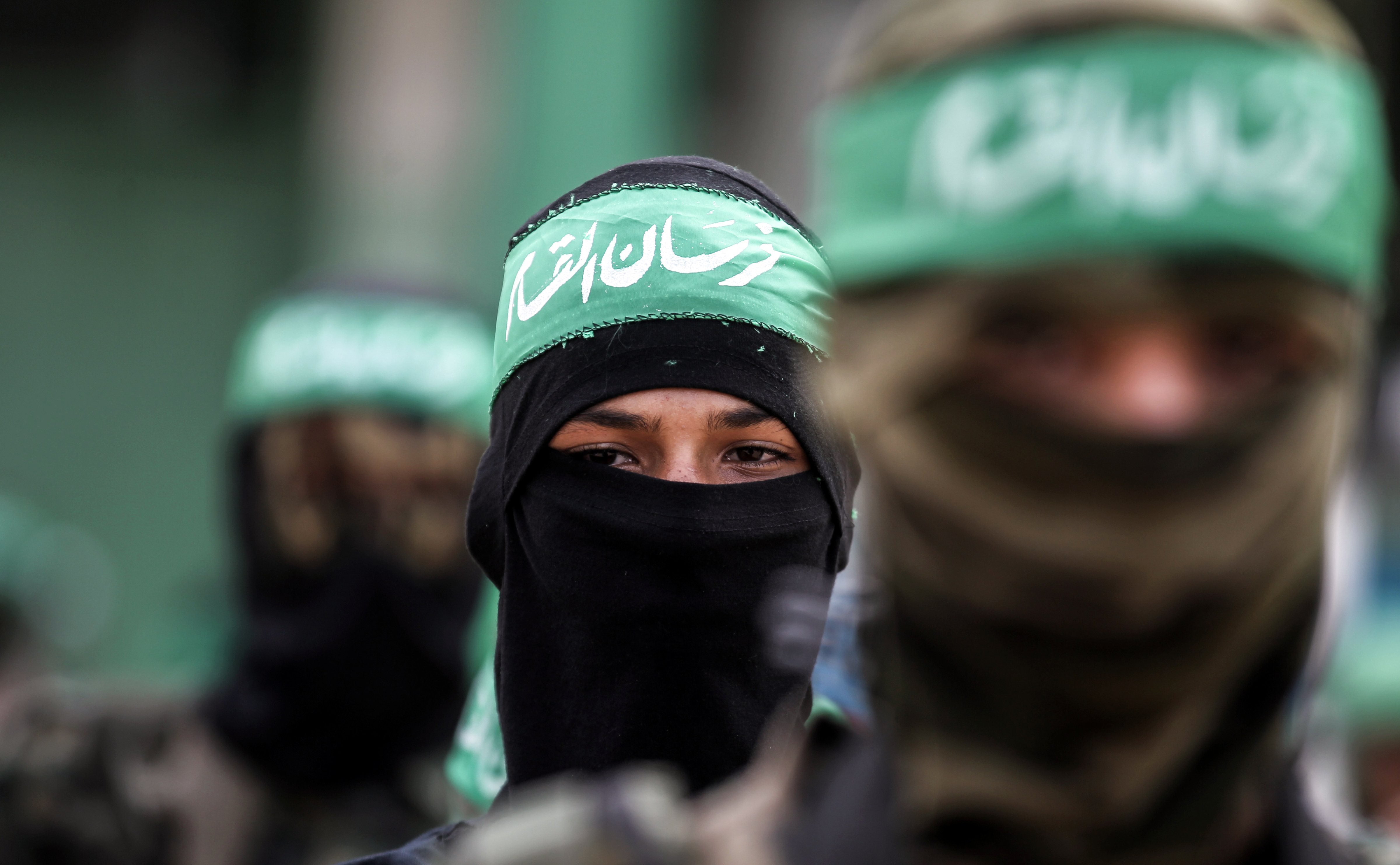 Masked youth cadets from the armed wing of the Palestinian Islamist Hamas movement march in the southern Gaza Strip on Sept. 15, 2017 (SAID KHATIB—AFP/Getty Images)