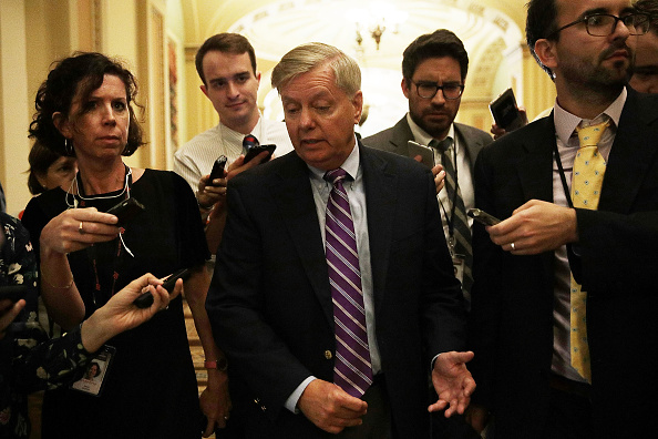 U.S. Sen. Lindsey Graham (R-SC) (C) speaks to members of the media after the weekly Senate Republican policy luncheon at the Capitol September 19, 2017 in Washington, DC.