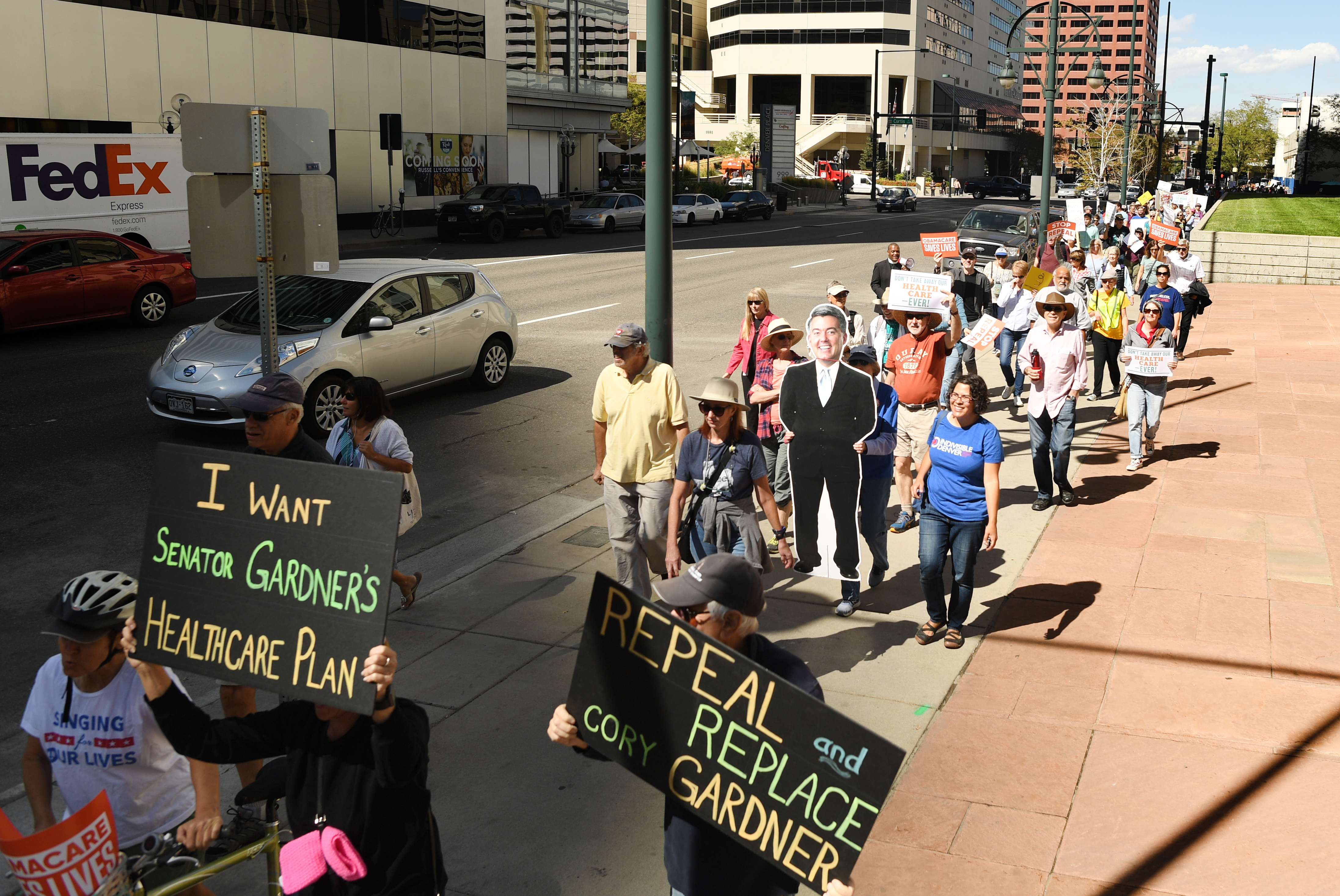 Several groups rally and march to U.S. Sen. Cory Gardner's office to pressure him to reject the Graham-Cassidy health care bill on September 22, 2017 in Denver, Colorado. (RJ Sangosti—Denver Post via Getty Images)