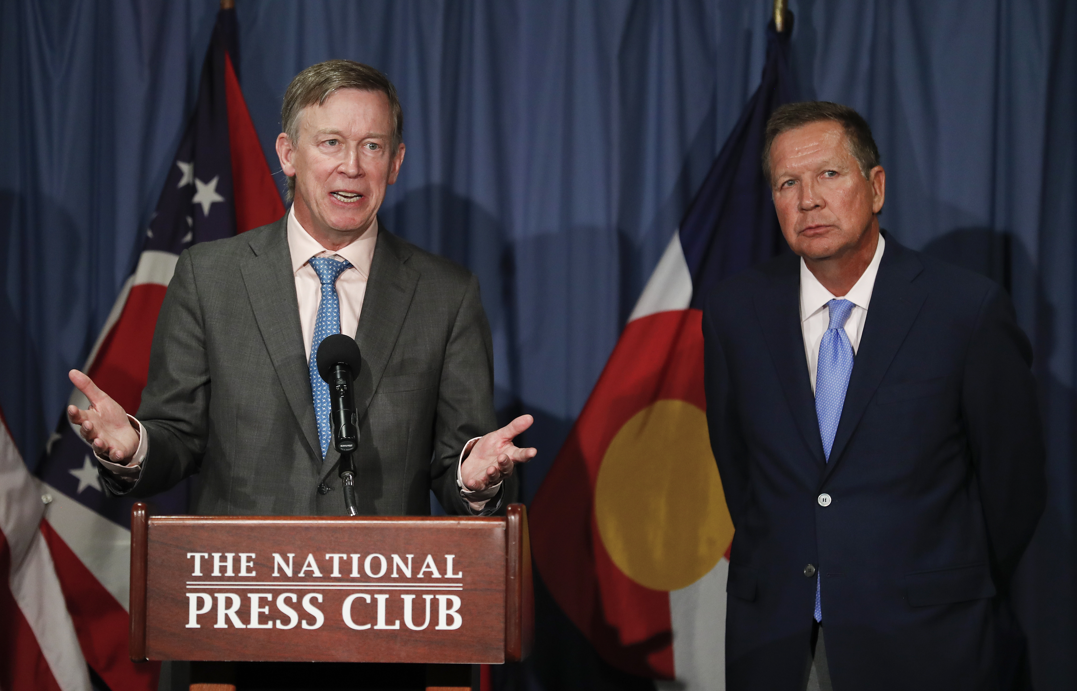 Colorado Gov. John Hickenlooper, left, joined by Ohio Gov. John Kasich, speaks during a news conference at the National Press Club in Washington on June 27, 2017. (Carolyn Kaster&mdash;AP)