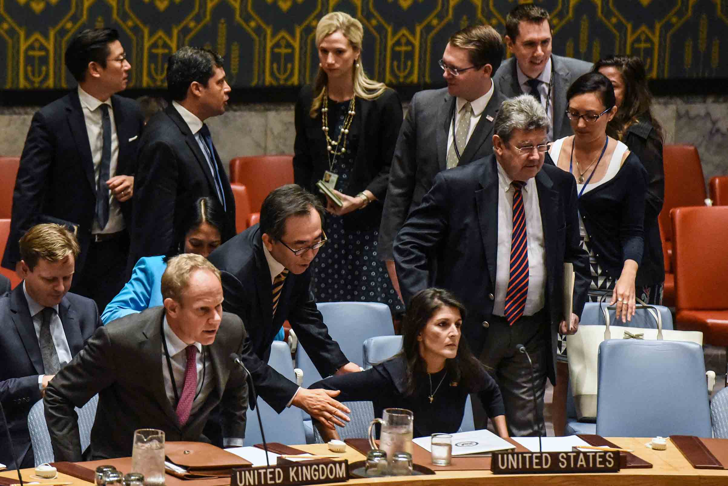 South Korean Ambassador Cho Tae-Yul tries to get the attention of Ambassador to the UN, Nikki Haley during a United Nations Security Council meeting on North Korea on Sept. 4 in New York City. (Stephanie Keith—Getty Images)
