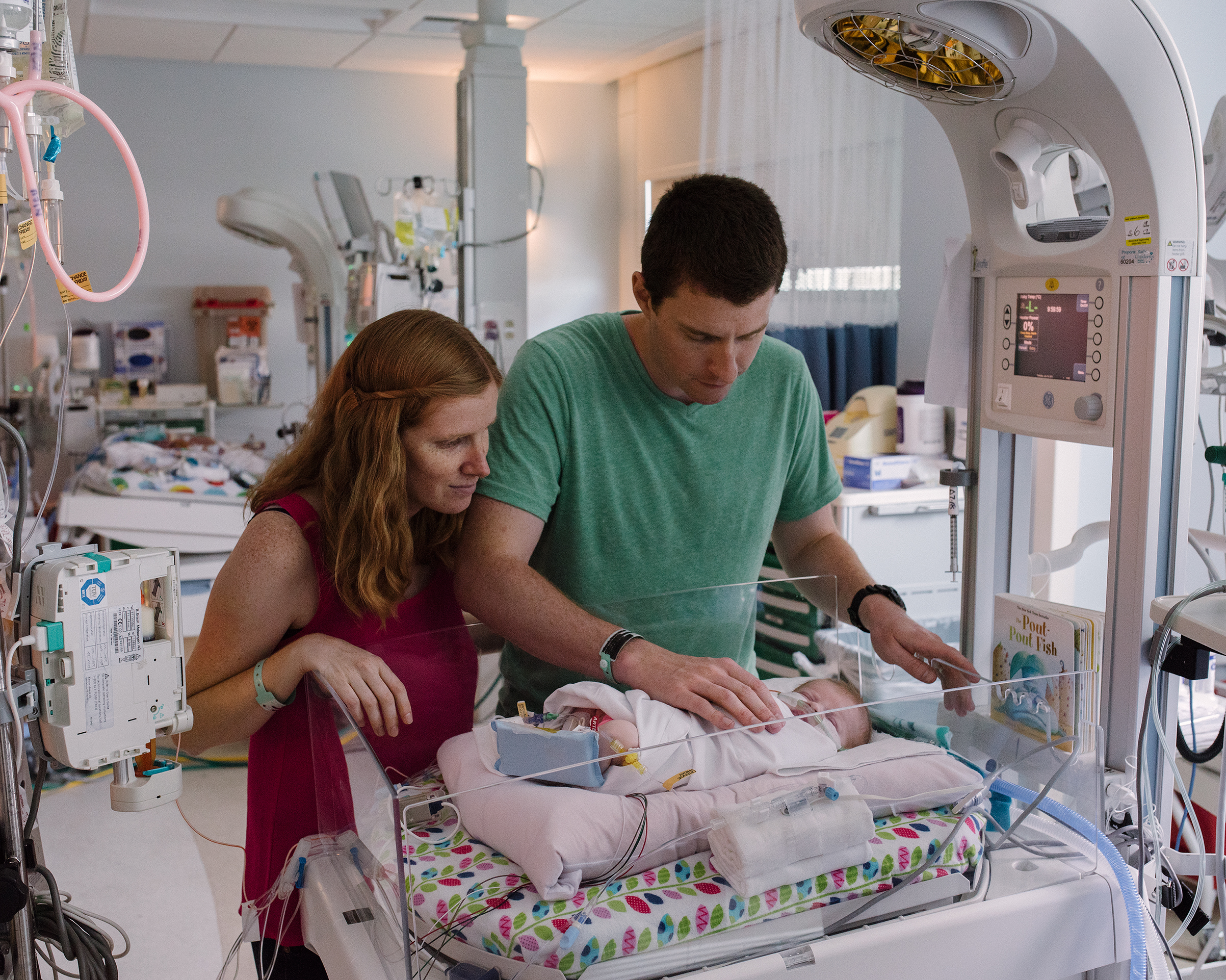 Elizabeth and Tristan Holbrook spend time with their newborn daughter Grace, Rady Children’s Hospital, San Diego, CA, July 18, 2017 (John Francis Peters for TIME)
