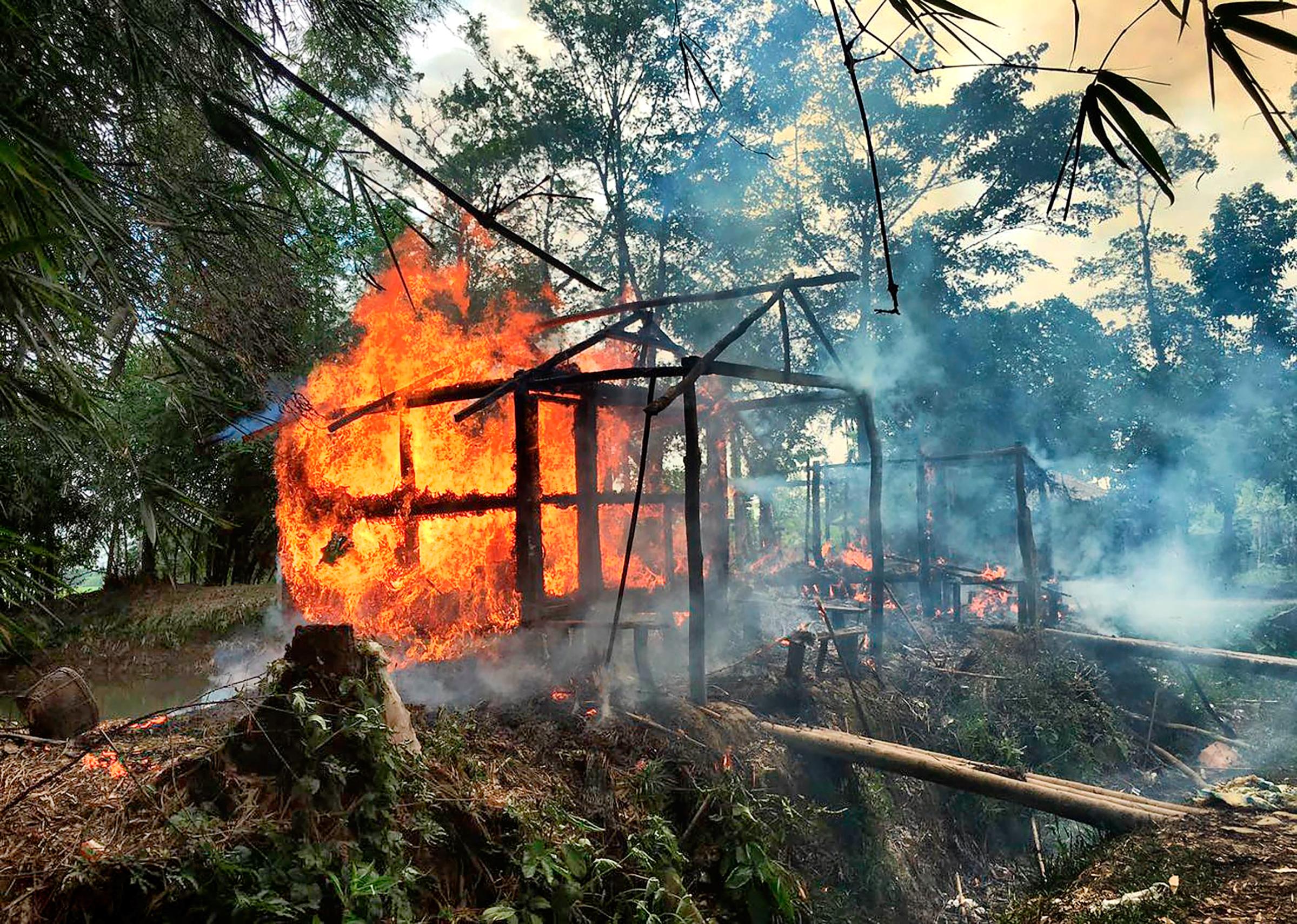 a Rohingya village burning in Rakhine state on Sept. 7