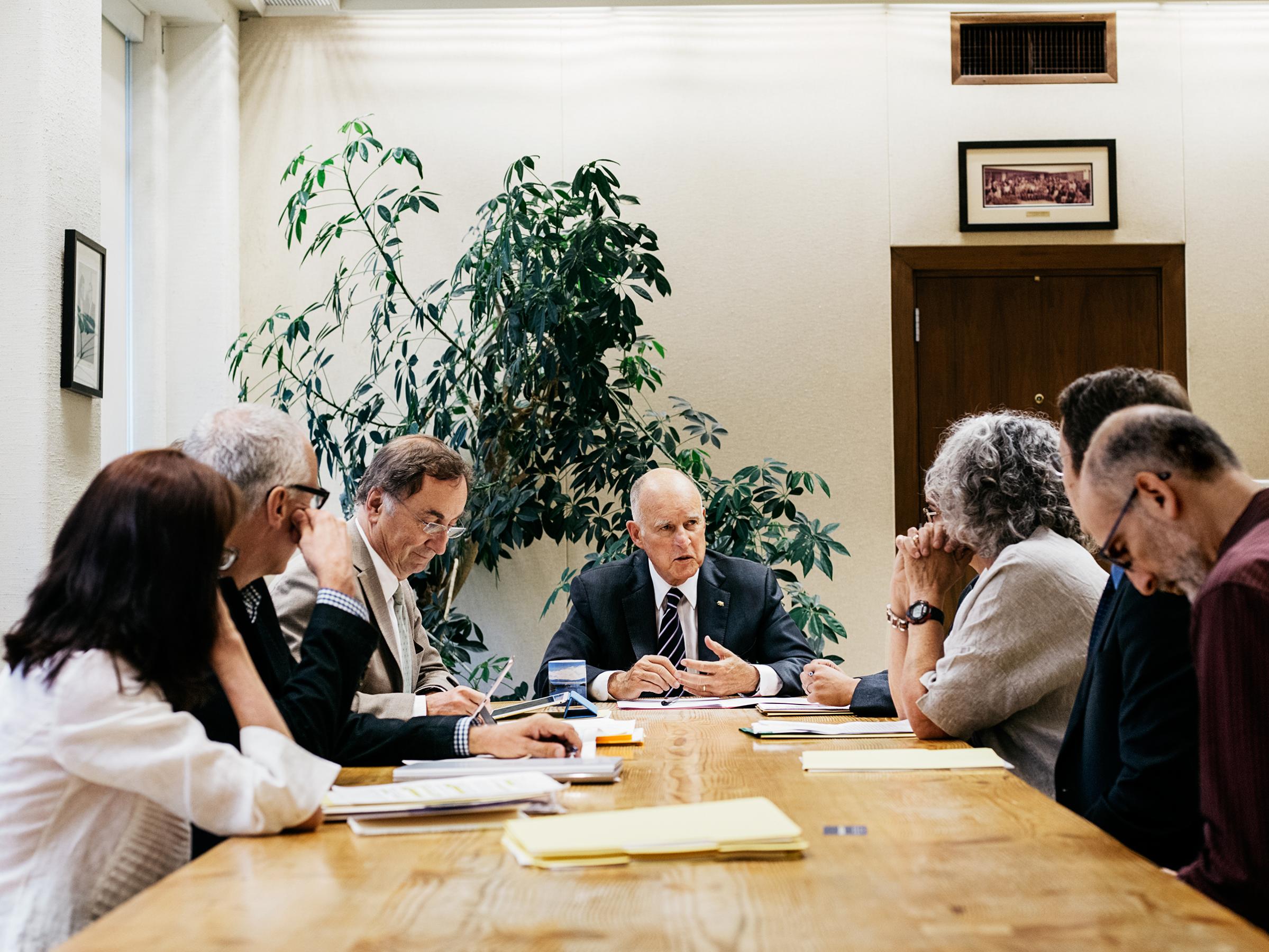 Brown hosts a meeting with environmental experts at his office in Sacramento