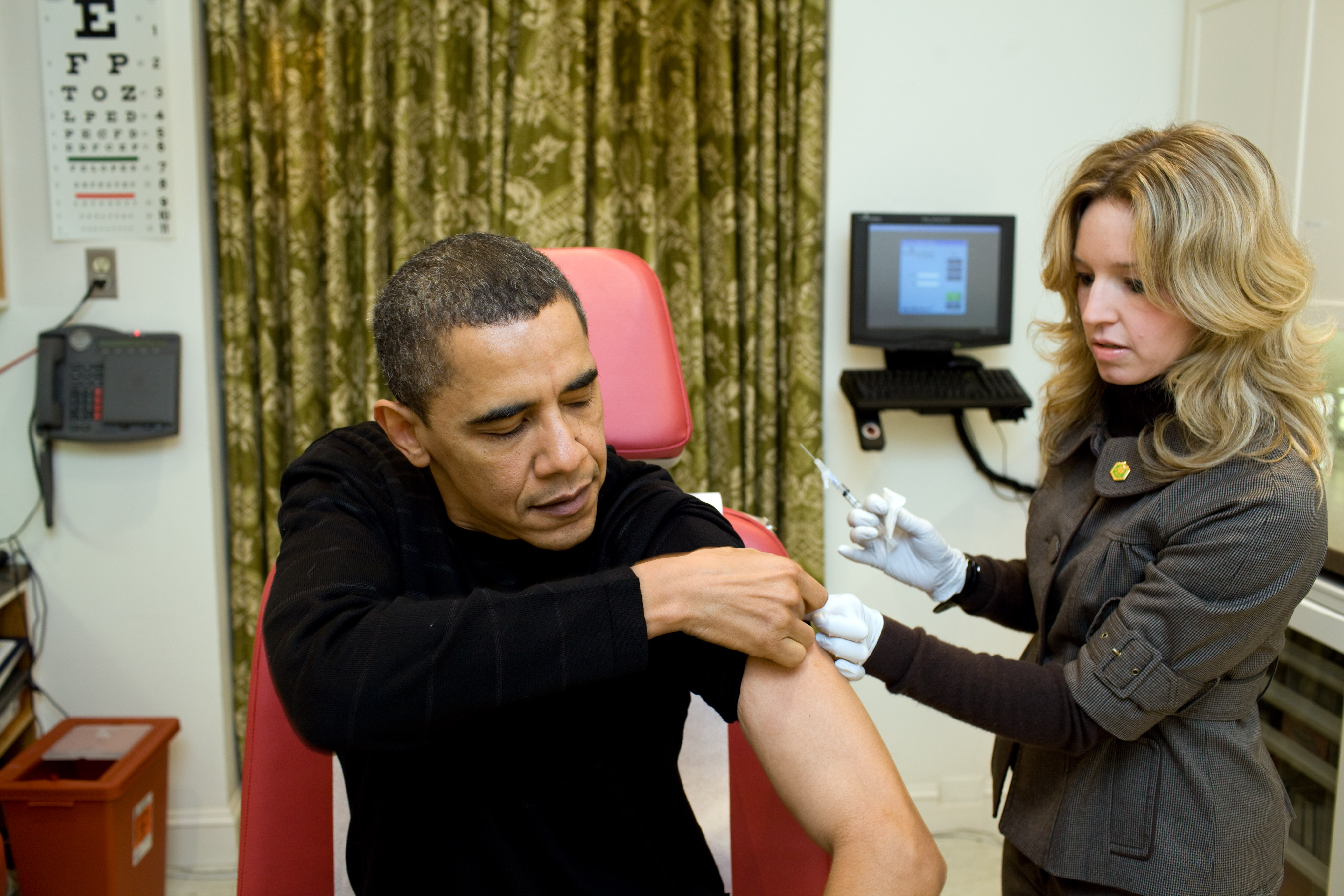 In this handout provided by the White House, A White House nurse prepares to administer the H1N1 vaccine to President Barack Obama at the White House on December 20, 2009 in Washington, DC. (Pete Souza—White House/Getty Images)