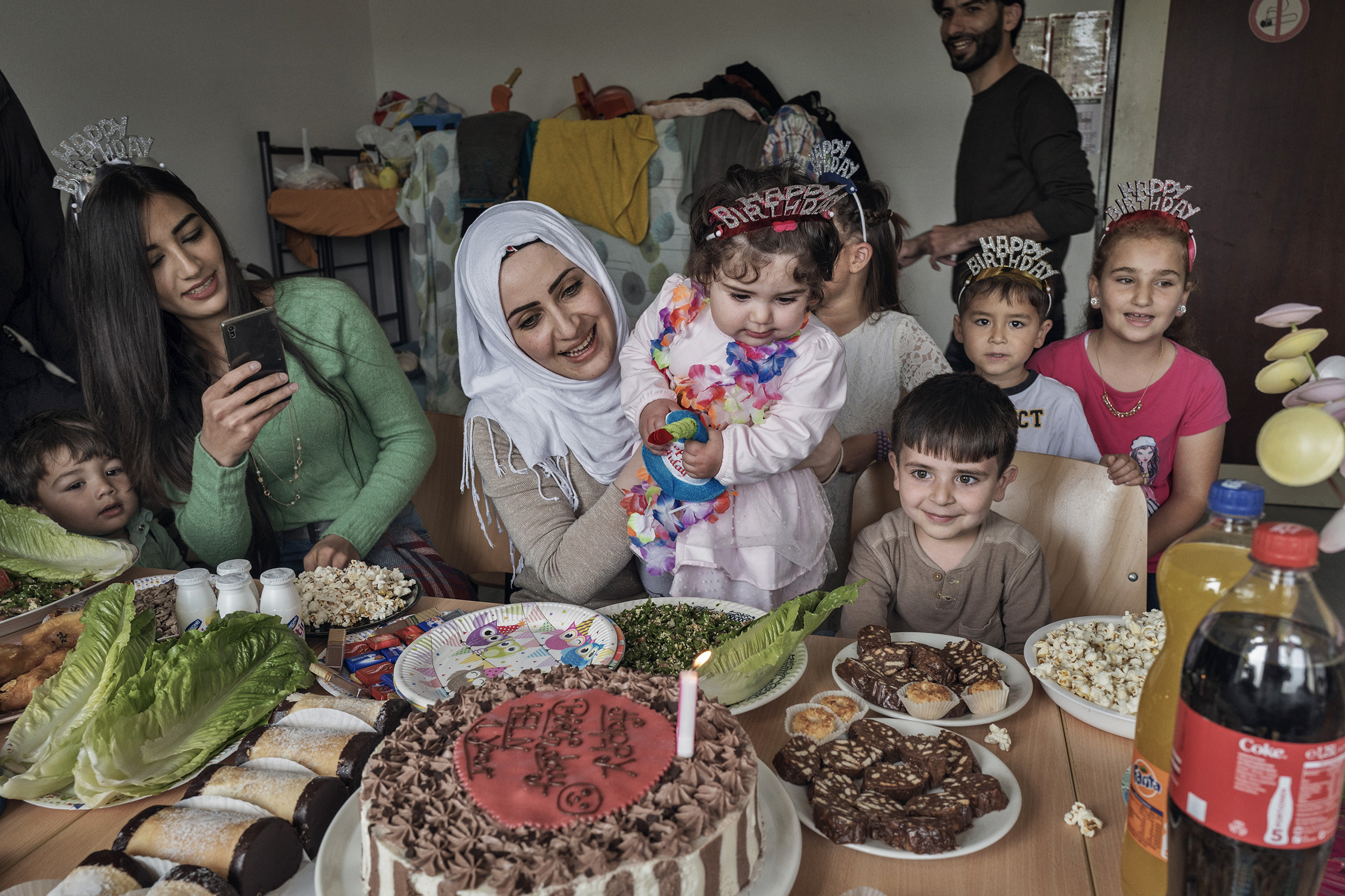 Taimaa Abazli celebrates the first birthday of her daughter Heln in a refugee camp in Kusel, Germany, on Sept. 13; she and her husband Mohannad were denied asylum in Germany but are appealing the ruling (Lynsey Addario for TIME)