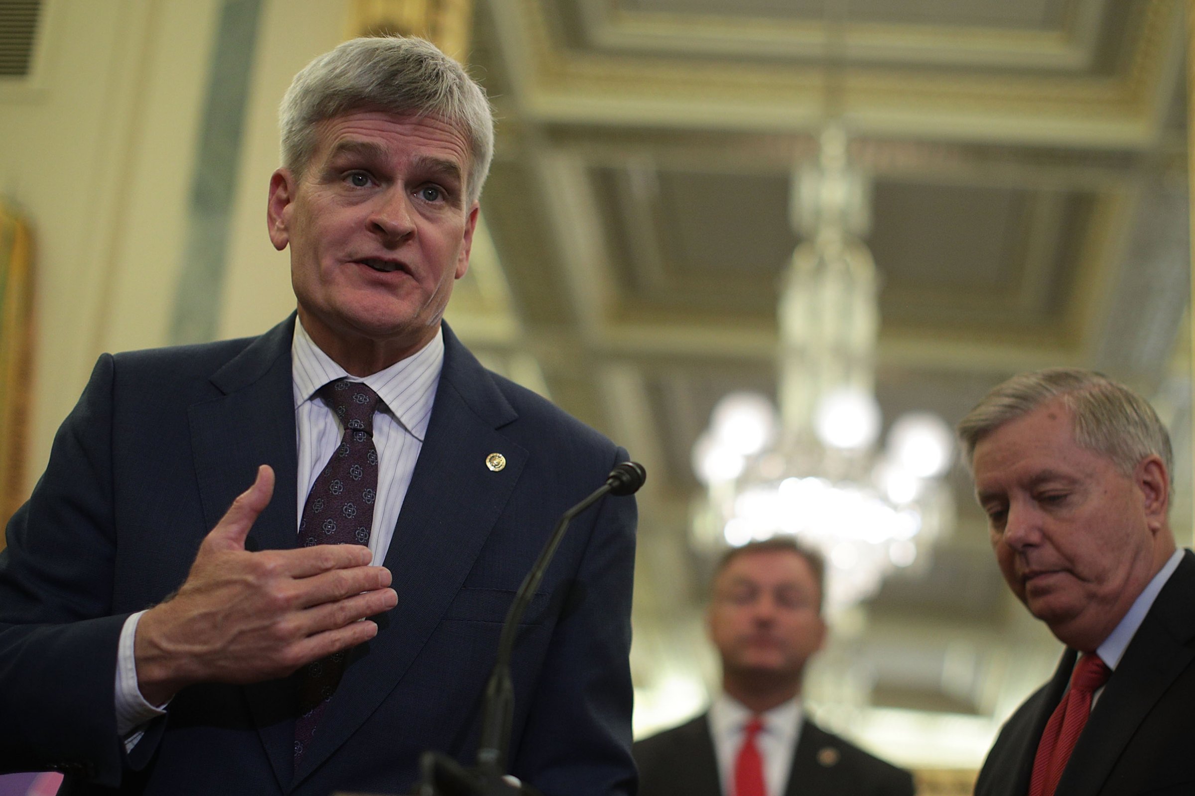 Sen. Bill Cassidy speaks as Sen. Dean Hellerand (center) and Sen. Lindsey Graham (right) listen during a news conference on health care Sept. 13, 2017 on Capitol Hill in Washington. Senators Graham, Cassidy, Heller and Johnson unveiled a proposed legislation to repeal and replace the Obamacare.