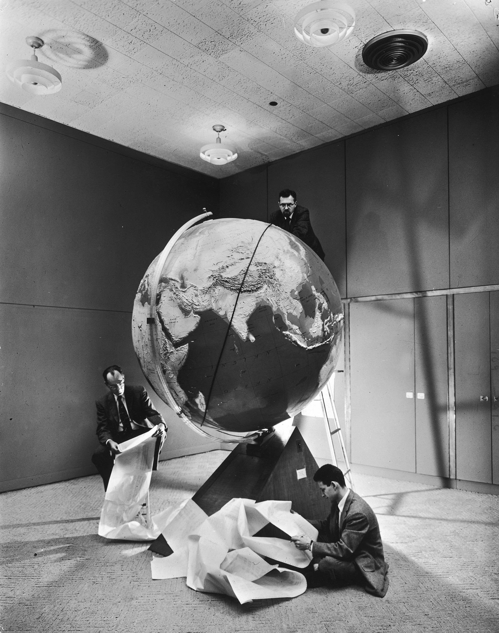 Smithsonian Institution scientists Dr. Josef A. Hynek, Fred L. Whipple and Don Lautman plotting orbit of Sputnik I.