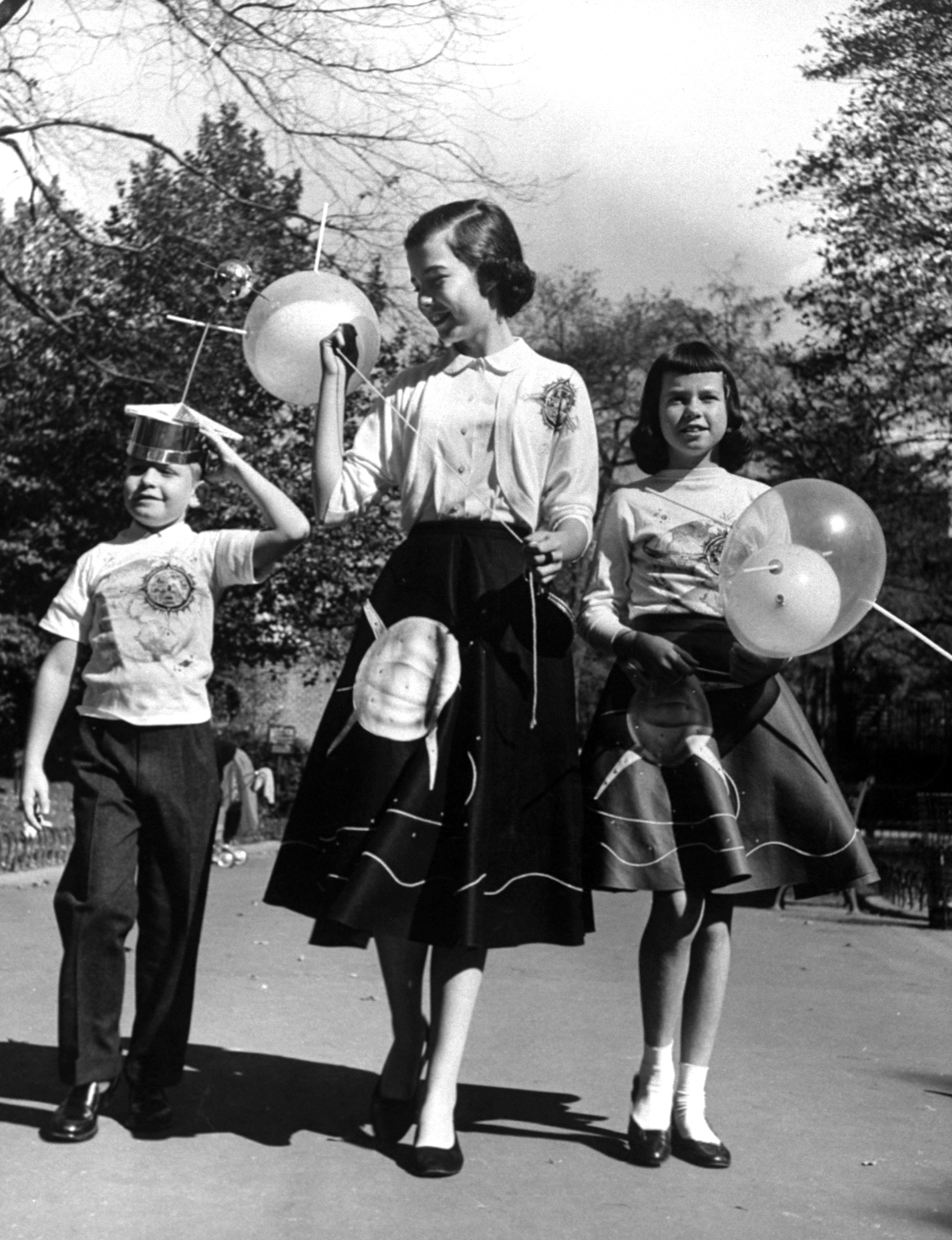 Space fashions rushed onto market include skirts, jackets, hats, balloons with satellite motif.