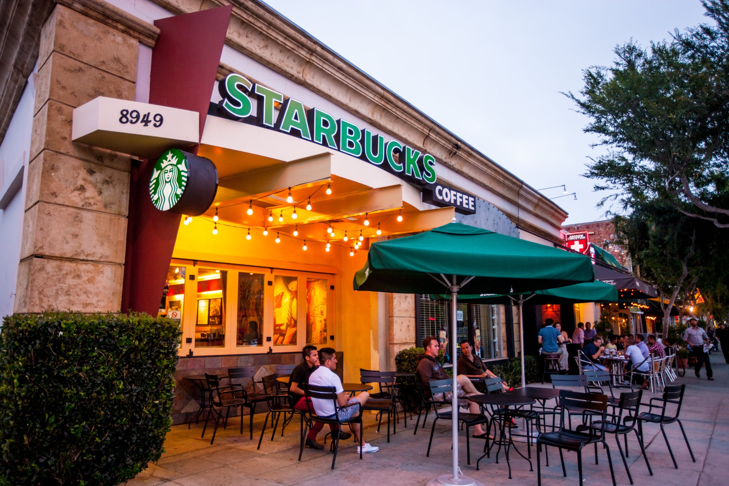 People sitting at Starbucks Coffee in West Hollywood, USA