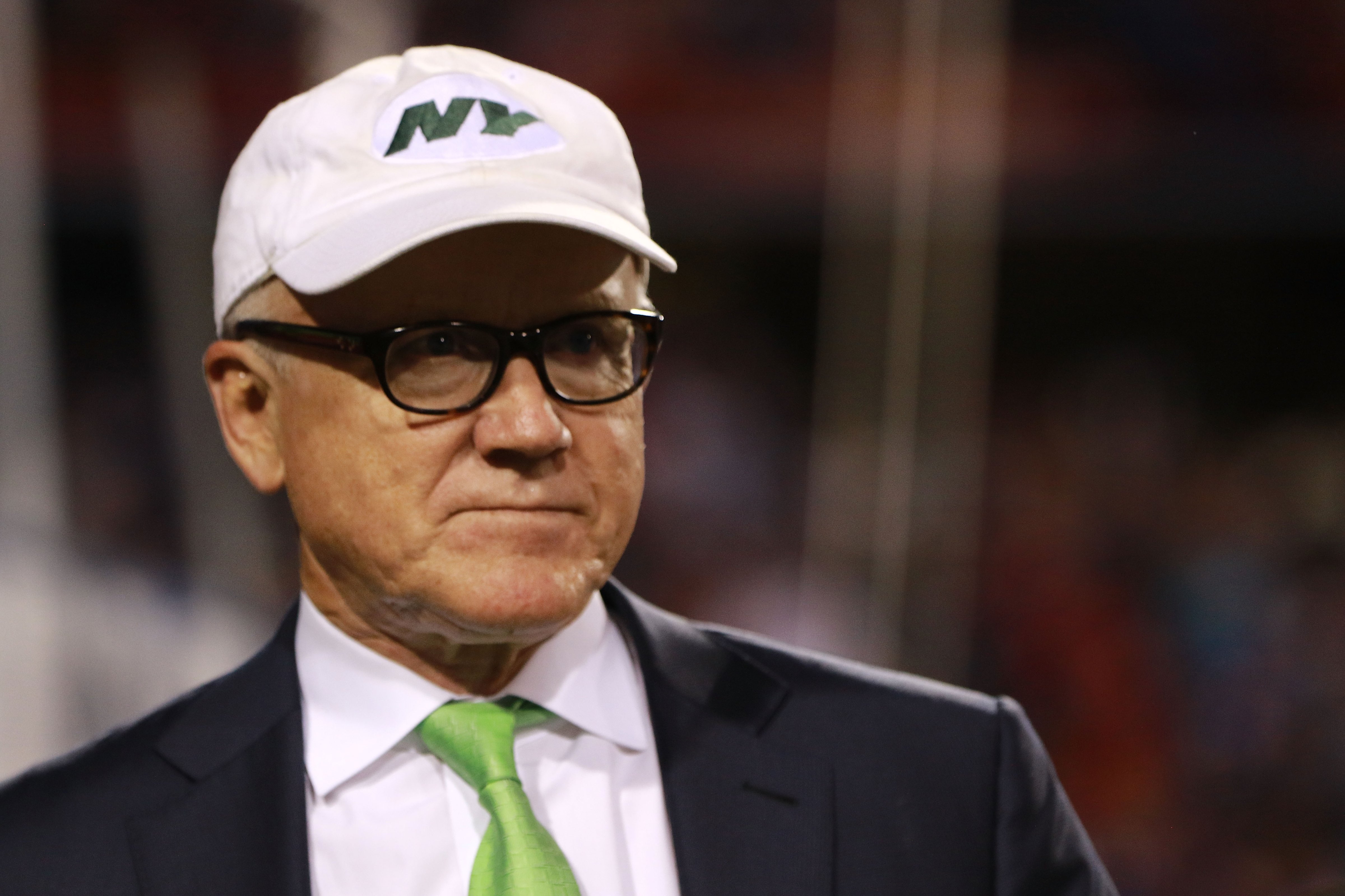 New York Jets owner Woody Johnson talks on the sidelines before the game against the Buffalo Bills. (Michael Adamucci - Getty Images)