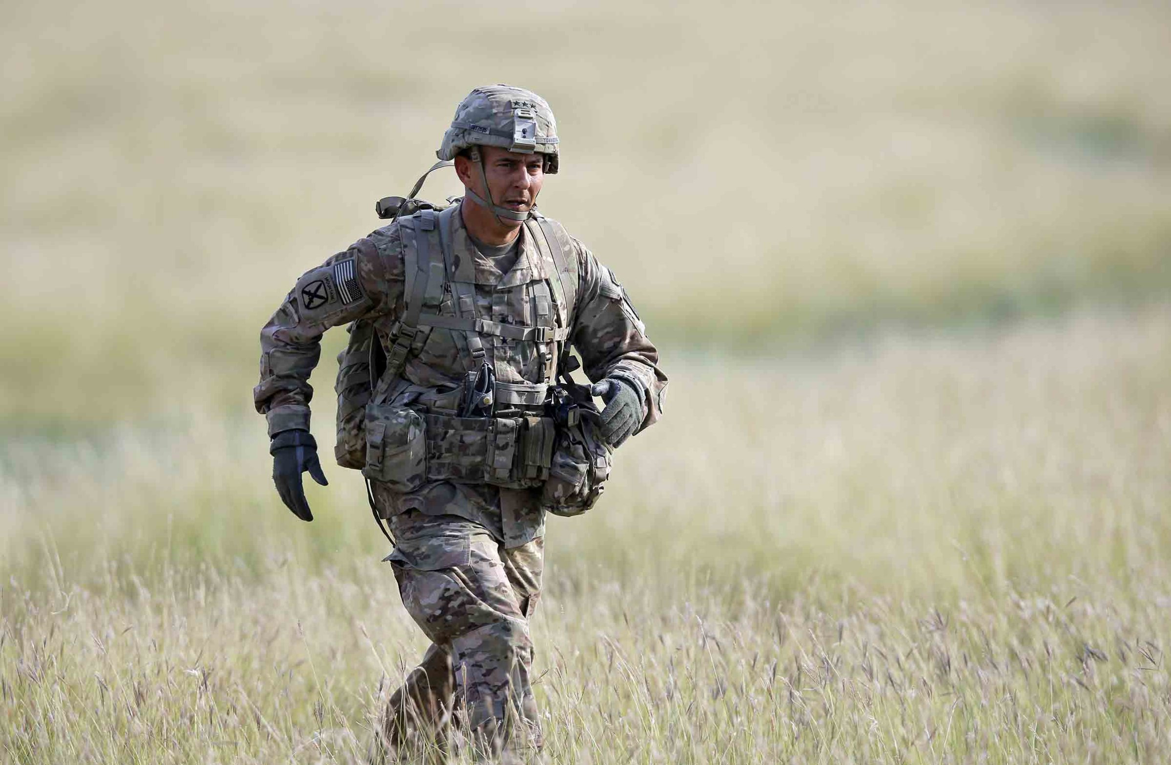 Maj. Gen. Stephen J. Townsend, the commander of the 18th Airborne Corps, runs towards the media working area during an US Army-led airborne assault exercise named 'Swift Response 15', held at Smardan shooting range, 260 kilometers north-east of Bucharest, Romania, Aug. 26 2015.