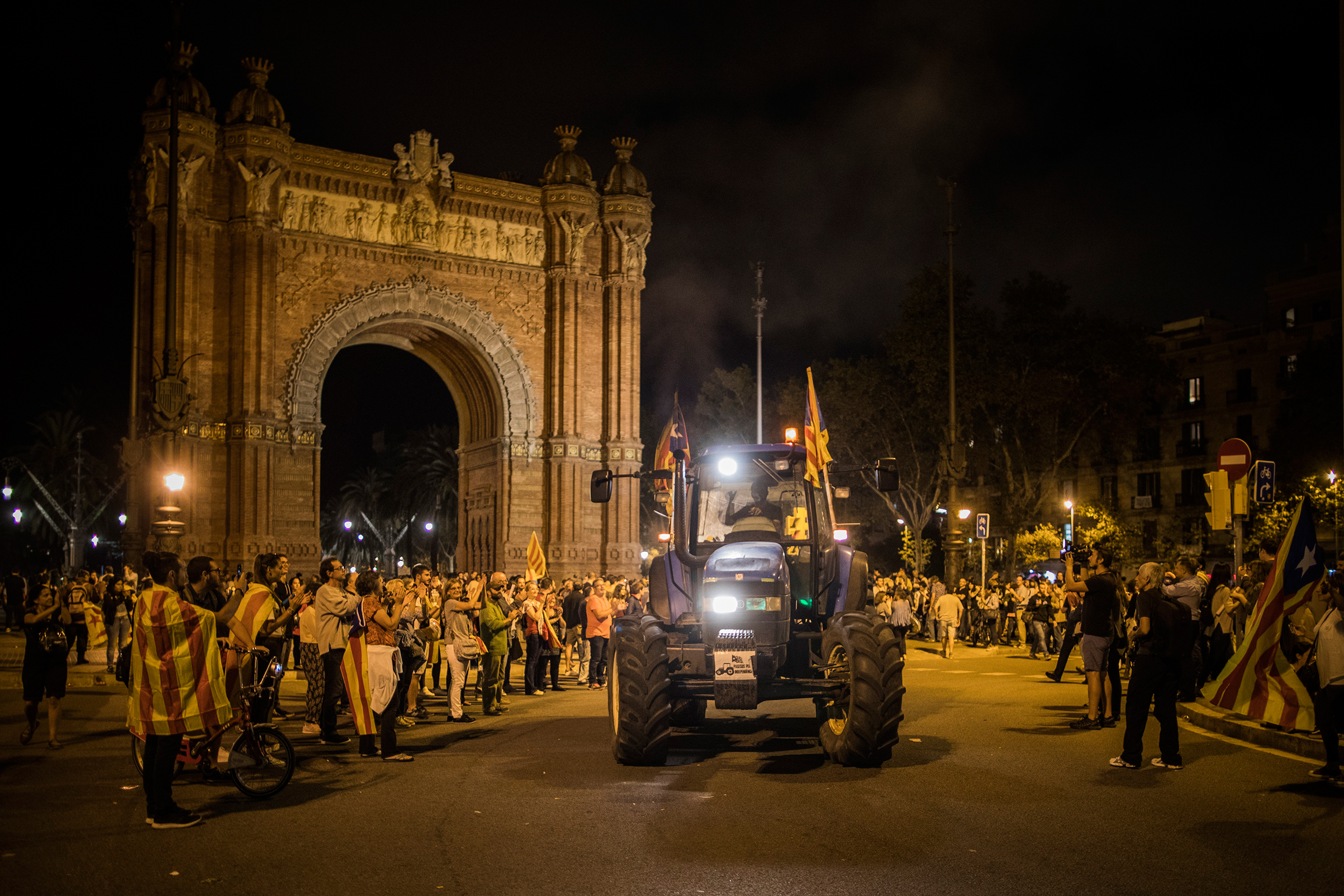 A supporter of independence drives a tractor near Barcelona’s Arc de Triomf after Puigdemont’s remarks on Oct. 10 (Santi Palacios for TIME)