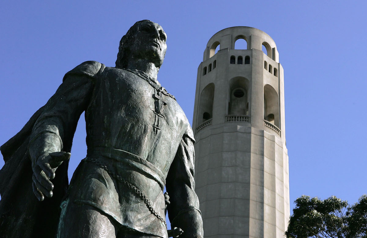 A statue of Christopher Columbus is seen next to Coit Tower on March 25, 2005 in San Francisco (Justin Sullivan / Getty Images)