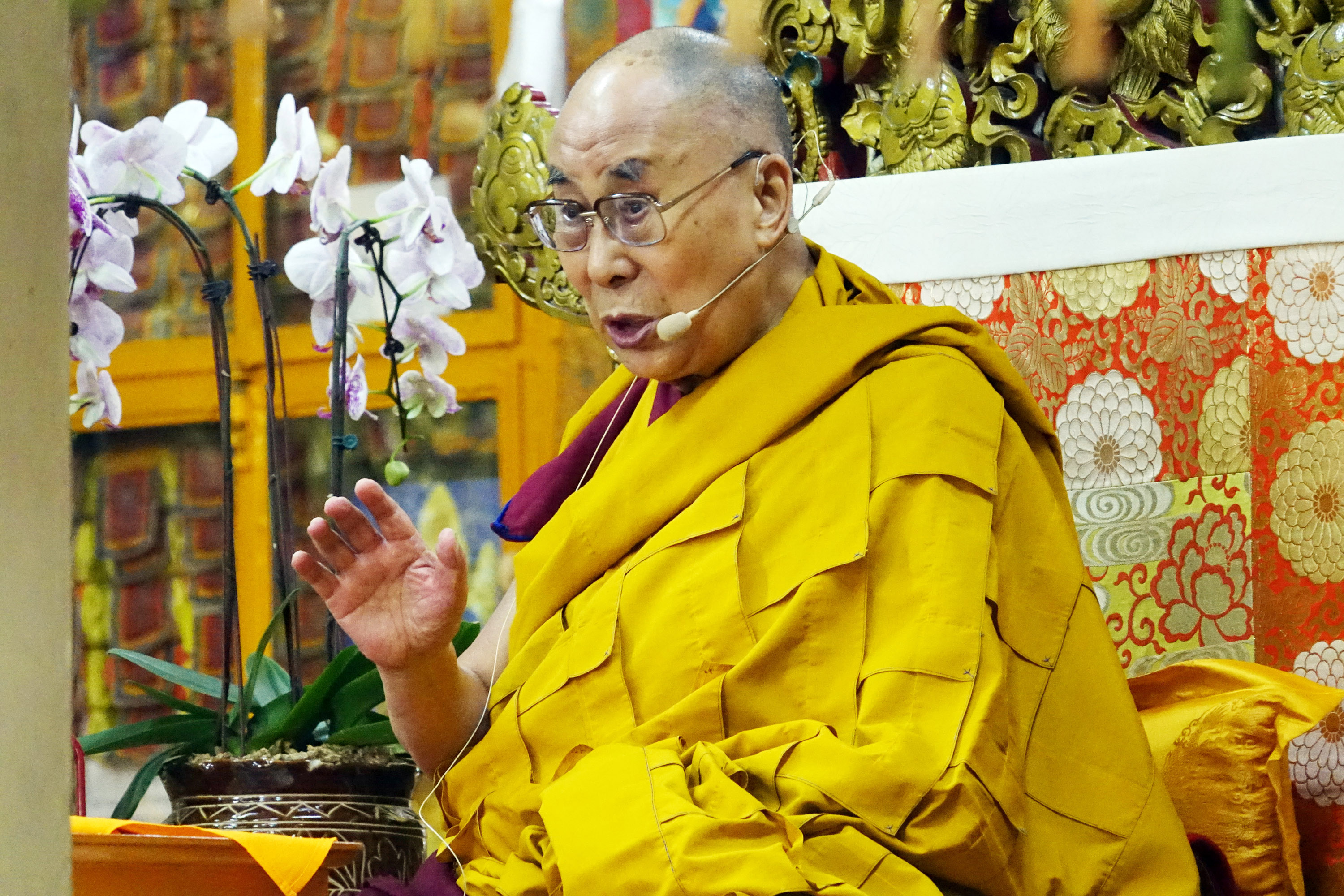 Tibetan spiritual leader the Dalai Lama sits on his ceremonial chair as he prays before beginning a religious talk at the Tsuglakhang Temple on Oct. 6, 2017 in Dharamsala, India. (Shyam Sharma—Hindustan Times/Getty Images)
