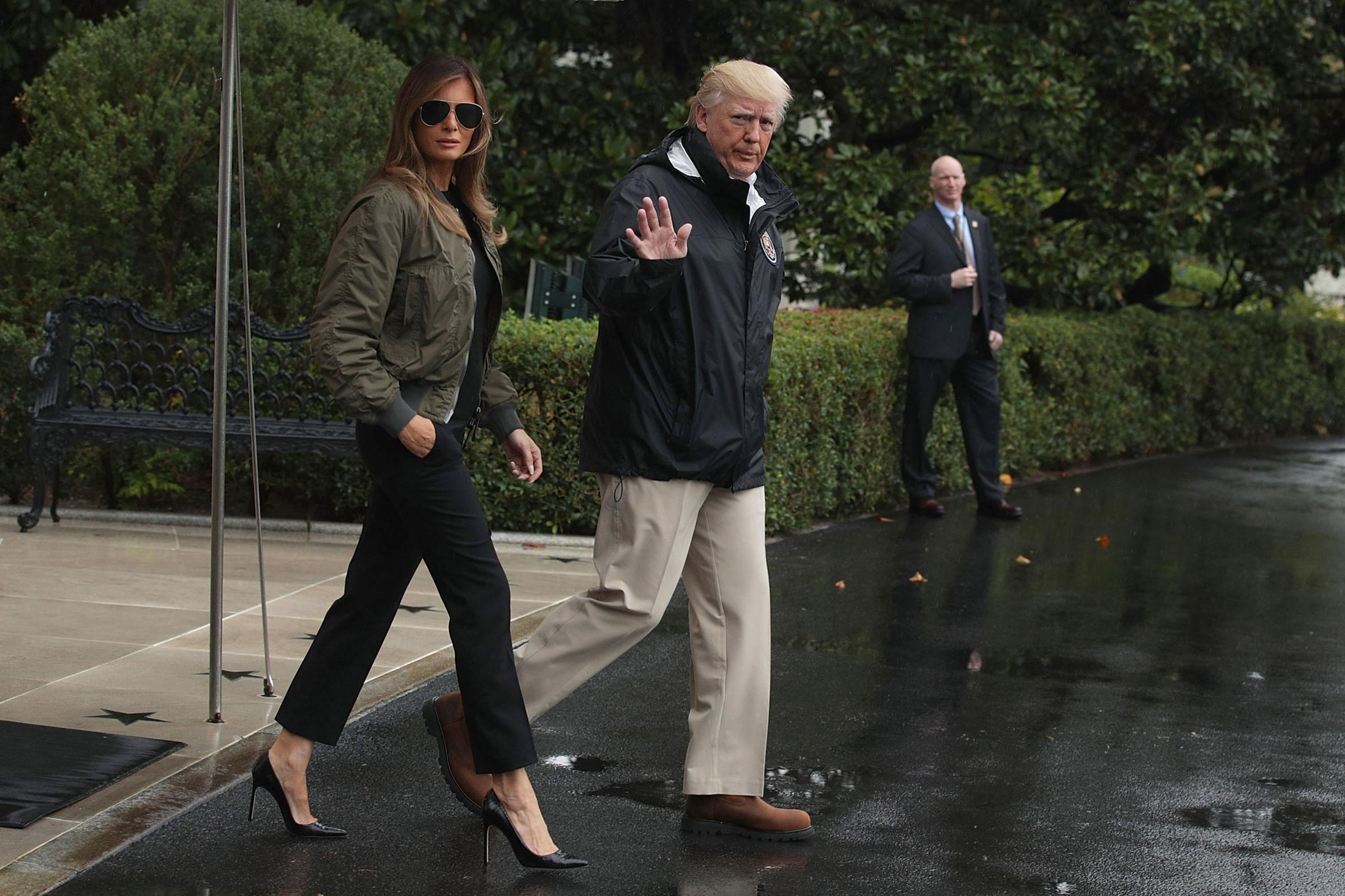 President Donald Trump walks with first lady Melania Trump, wearing Manolo Blahnik stilettos, on way to Texas to observe the Hurricane Harvey relief efforts, Aug.29, 2017.