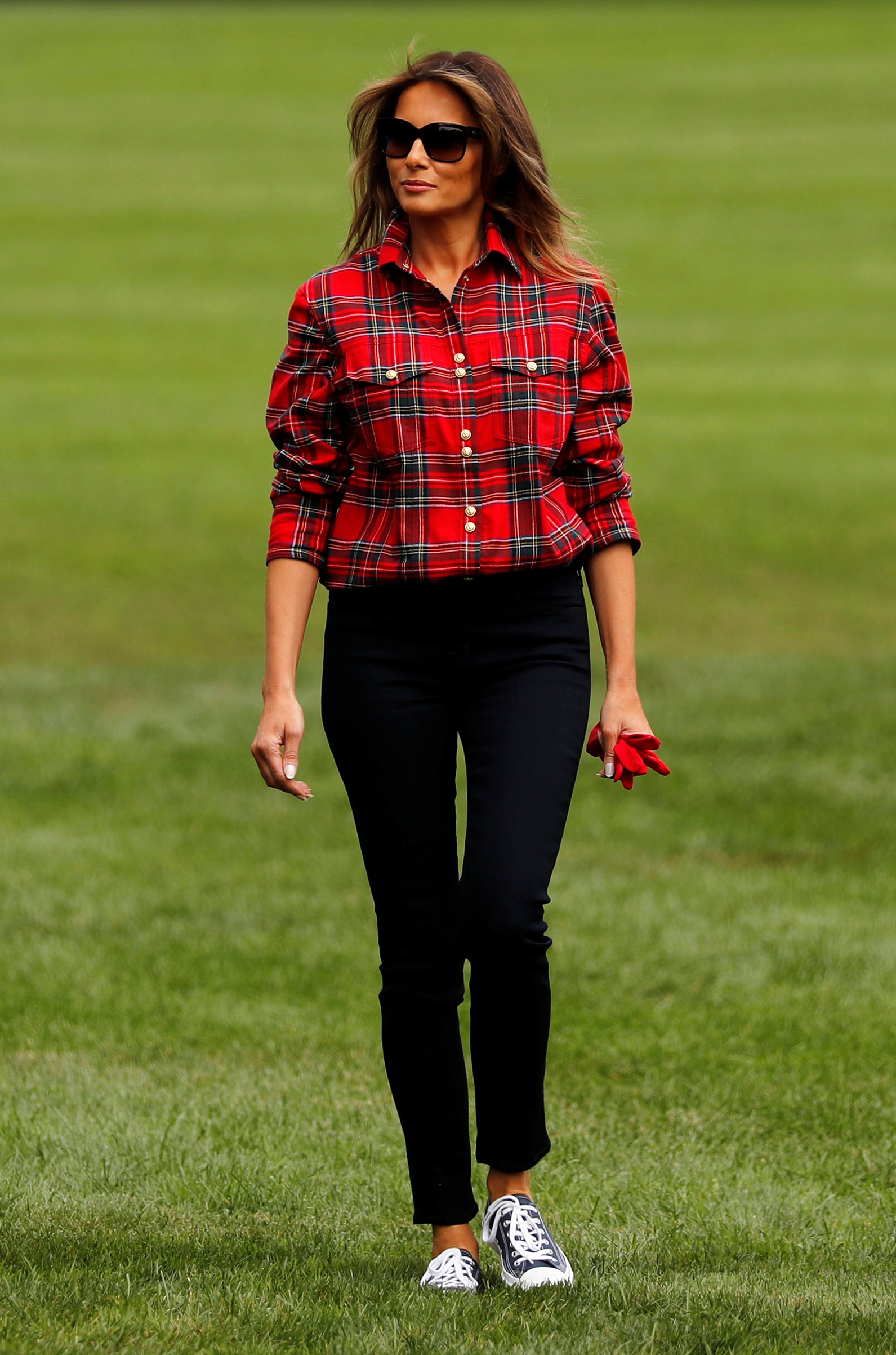 First Lady Melania Trump wearing a tartan Balmain shirt and Converse sneakers,  arrives to work in the White House kitchen garden with students from the Boys and Girls Clubs of Greater Washington, D.C. ,Sept. 22, 2017.