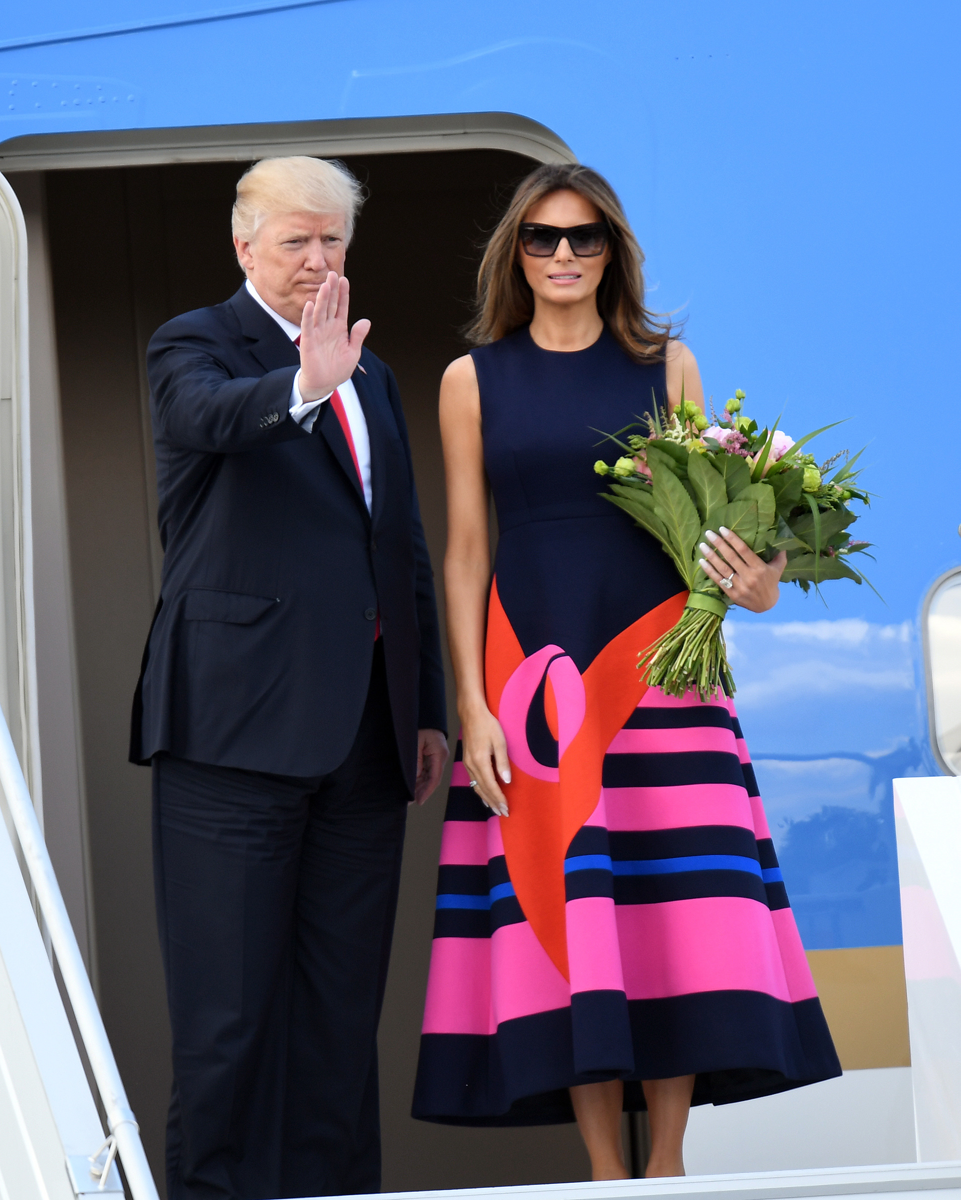President Donald Trump and the first lady Melania Trump wearing a midi-length Delpozo dress depart from Poland on July 06, 2017 in Warsaw, Poland.