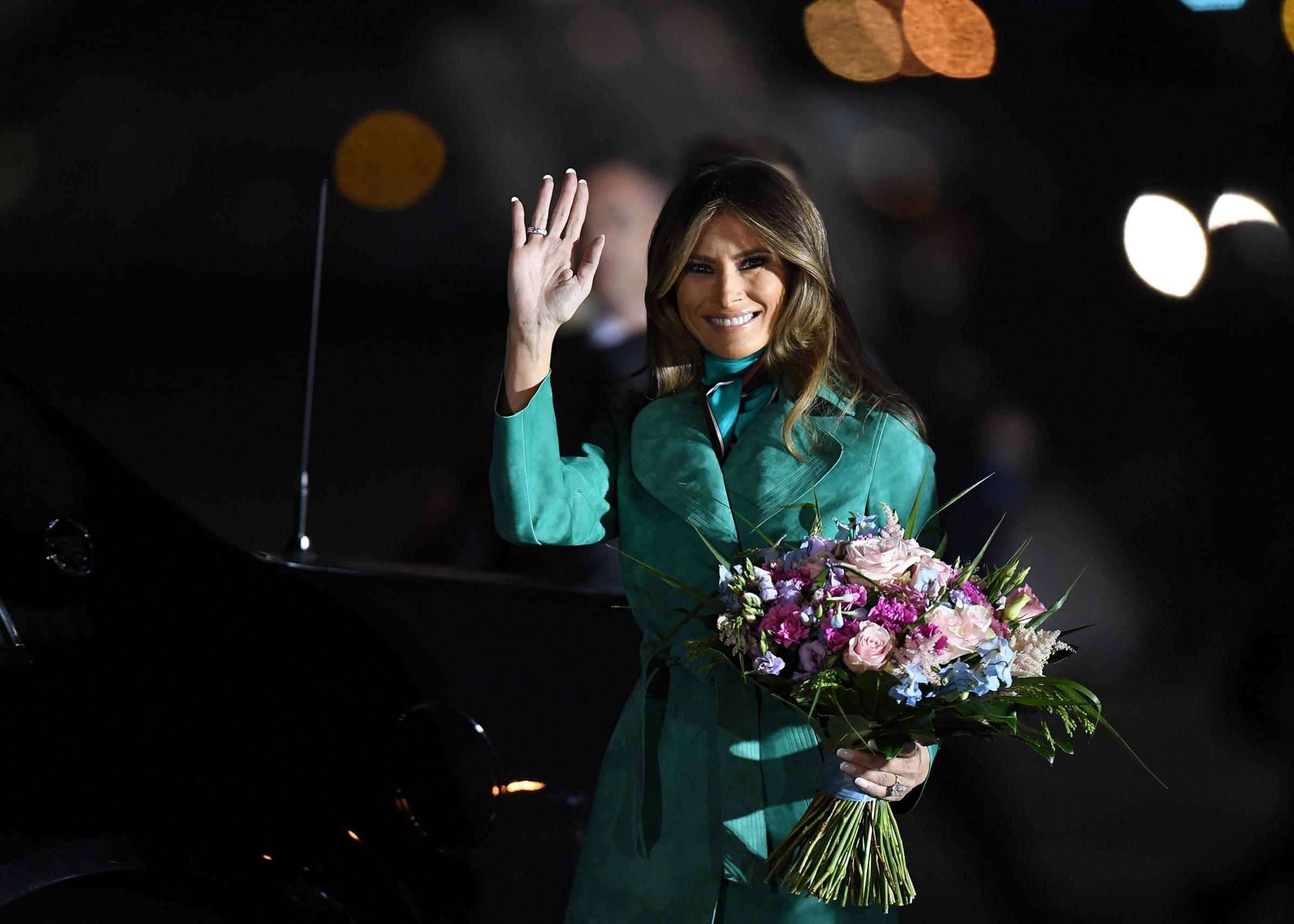 Arrival of President Trump and first lady Melania Trump, wearing green suede Diane von Furstenberg coat on July 05, 2017 in Warsaw, Poland.