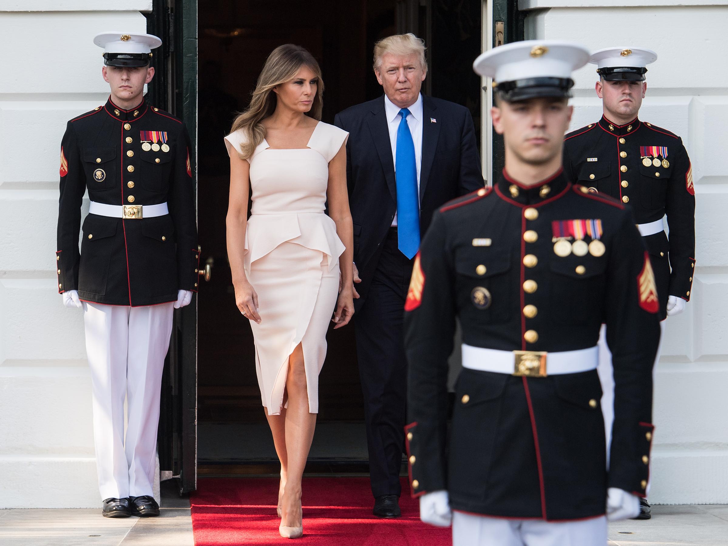 President Donald Trump and first lady Melania Trump wearing a Roland Mouret dress and Christian Louboutin shoes, walk out to receive South Korean President Moon Jae-in and his wife Kim Jeong-suk at the White House in Washington, DC, on June 29, 2017.
