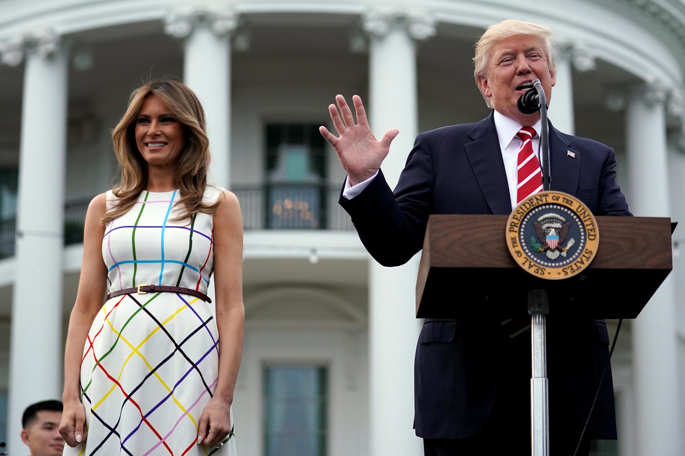 President Donald Trump delivers remarks as he hosts a Congressional picnic event, accompanied by First Lady Melania Trump wearing a dress made in Italy by Greek designer Mary Katrantzou, .at the White House in Washington, U.S., June 22, 2017.