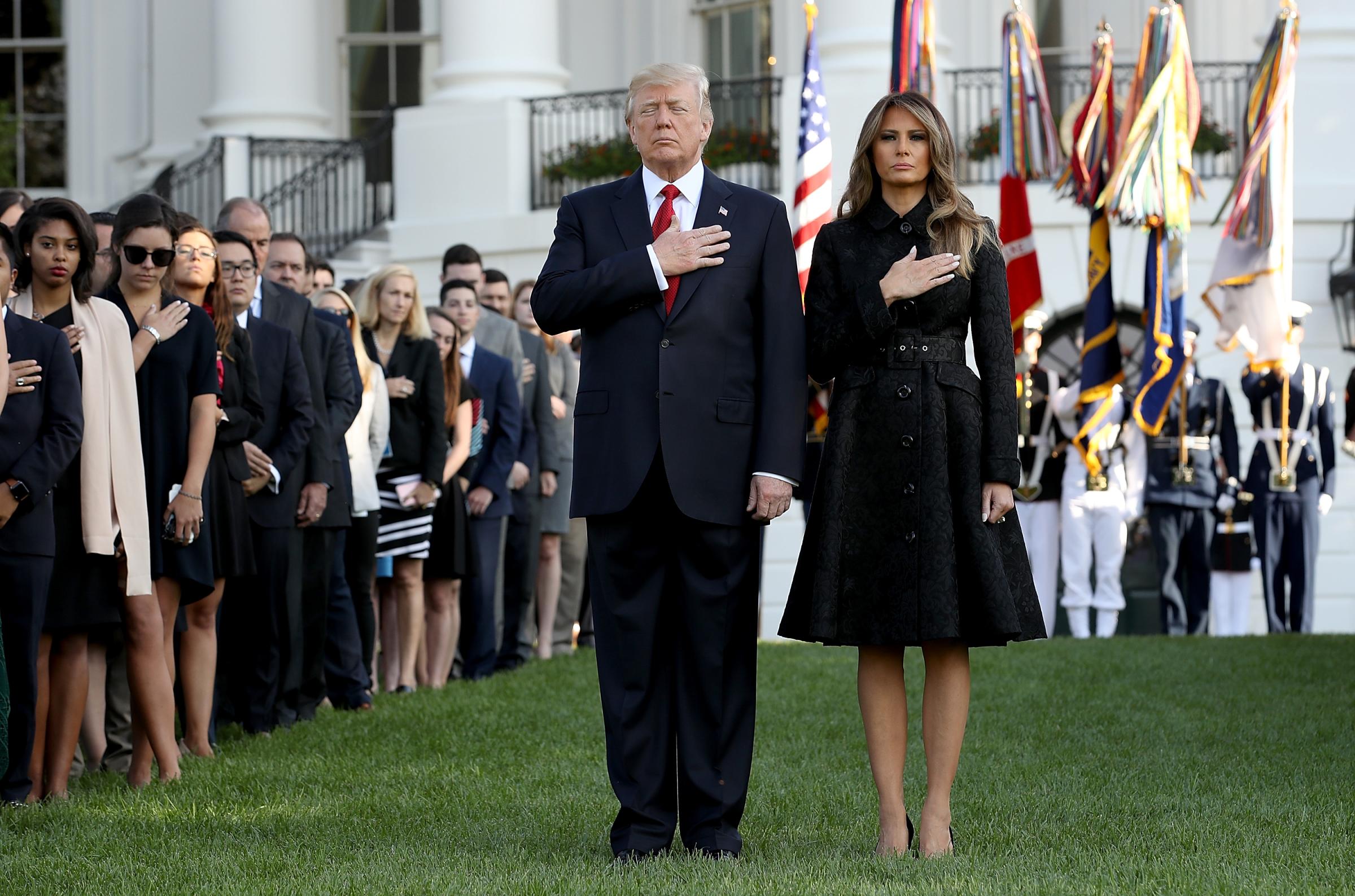 First lady Melania Trump, wear a black, long-sleeved coatdress by Michael Kors during a ceremony marking the September 11 attacks Sept.11, 2017 in Washington, DC.