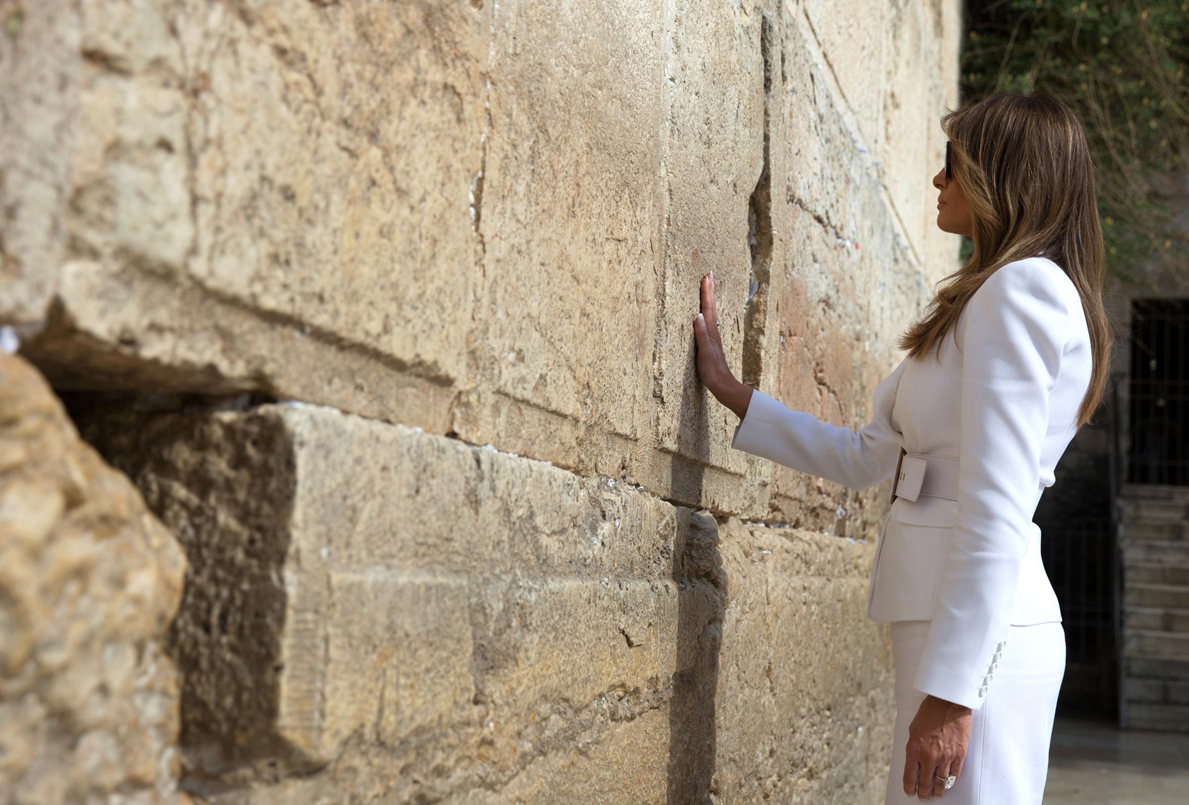 First lady Melania Trump wearing white Michael Kors Collection suit, visits the Western Wall, the holiest site where Jews can pray, in Jerusalems Old City on May 22, 2017.